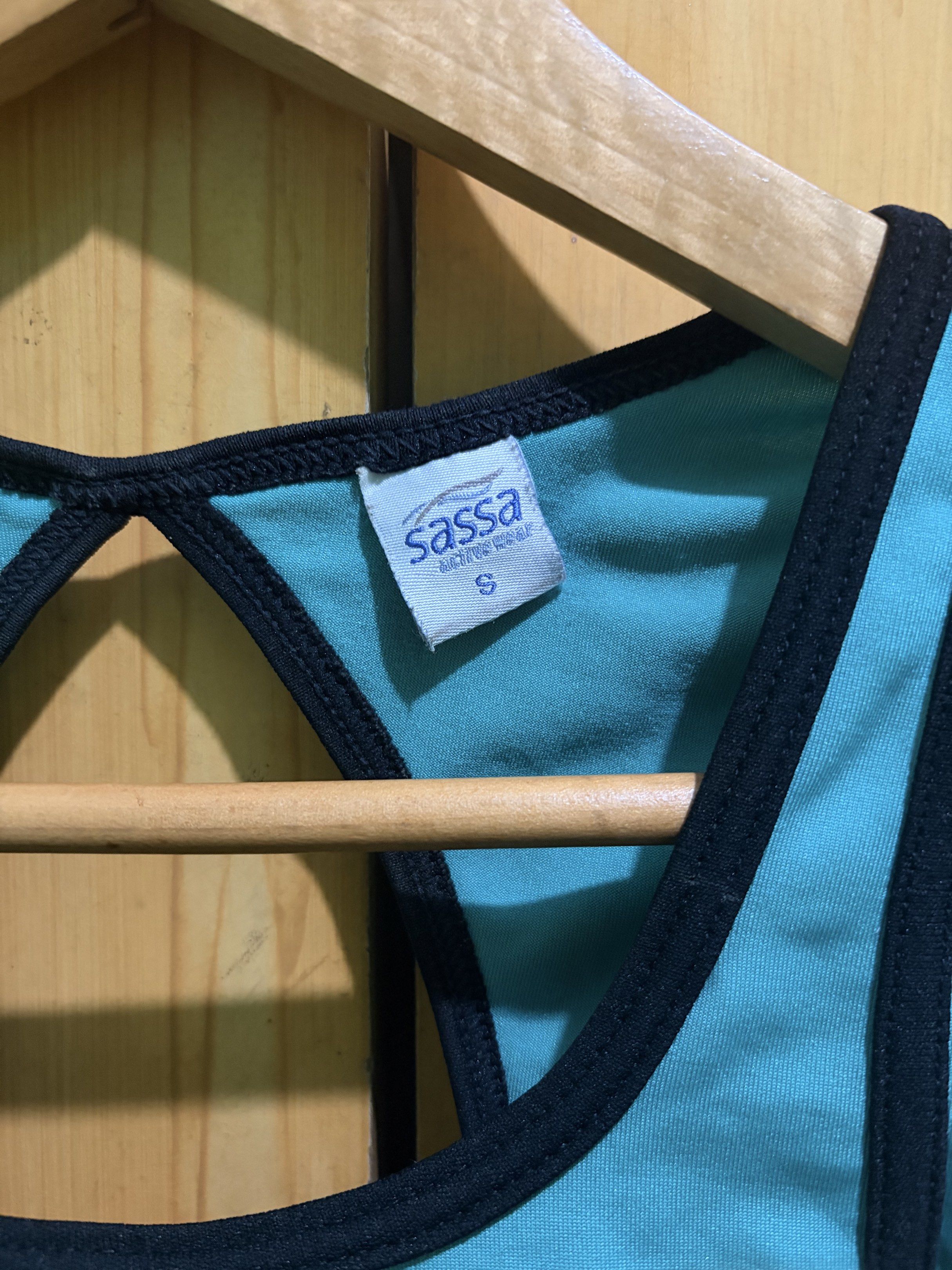 Sassa Sports Bra - Size S (Category: Activewear) located in Manila. Submitted by ciiii1 (Listing ID 1417734470, Image 3). Description: - Sassa sports bra - Teal color with black trim - Racerback design - Keyhole detail - Built-in padding - Size: S fits S-M - Perfect for workouts and everyday wear.