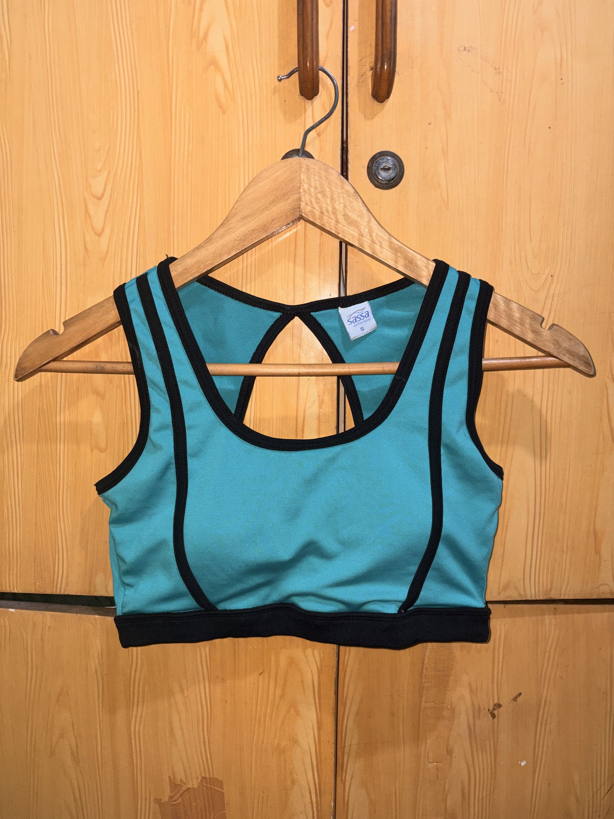 Sassa Sports Bra - Size S (Category: Activewear) located in Manila. Submitted by ciiii1 (Listing ID 1417734470, Image 2). Description: - Sassa sports bra - Teal color with black trim - Racerback design - Keyhole detail - Built-in padding - Size: S fits S-M - Perfect for workouts and everyday wear.