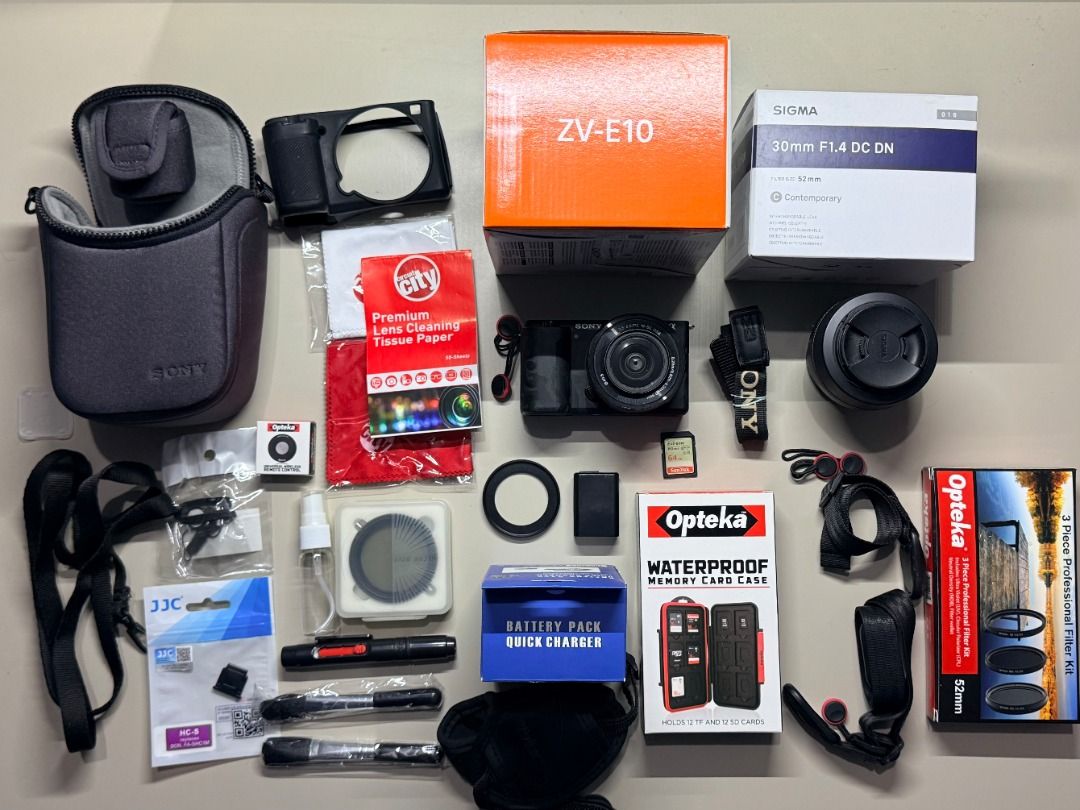 Sony ZV-E10 Camera with Sigma 30mm Lens (Category: Cameras) located in Baguio. Submitted by bnrd_ (Listing ID 1417809526, Image 1). Description: Selling my Sony ZV-E10 Mirrorless Camera Bundle, perfect for vlogging, content creation, photography, and video. Well taken care of and ready to use - no need to buy extra accessories. Included Items: - Sony ZV-E10 Mirrorless Camera - Sony 16–50mm Kit Lens - Sigma 30mm f/1.4 DC DN Contemporary Lens (E-mo