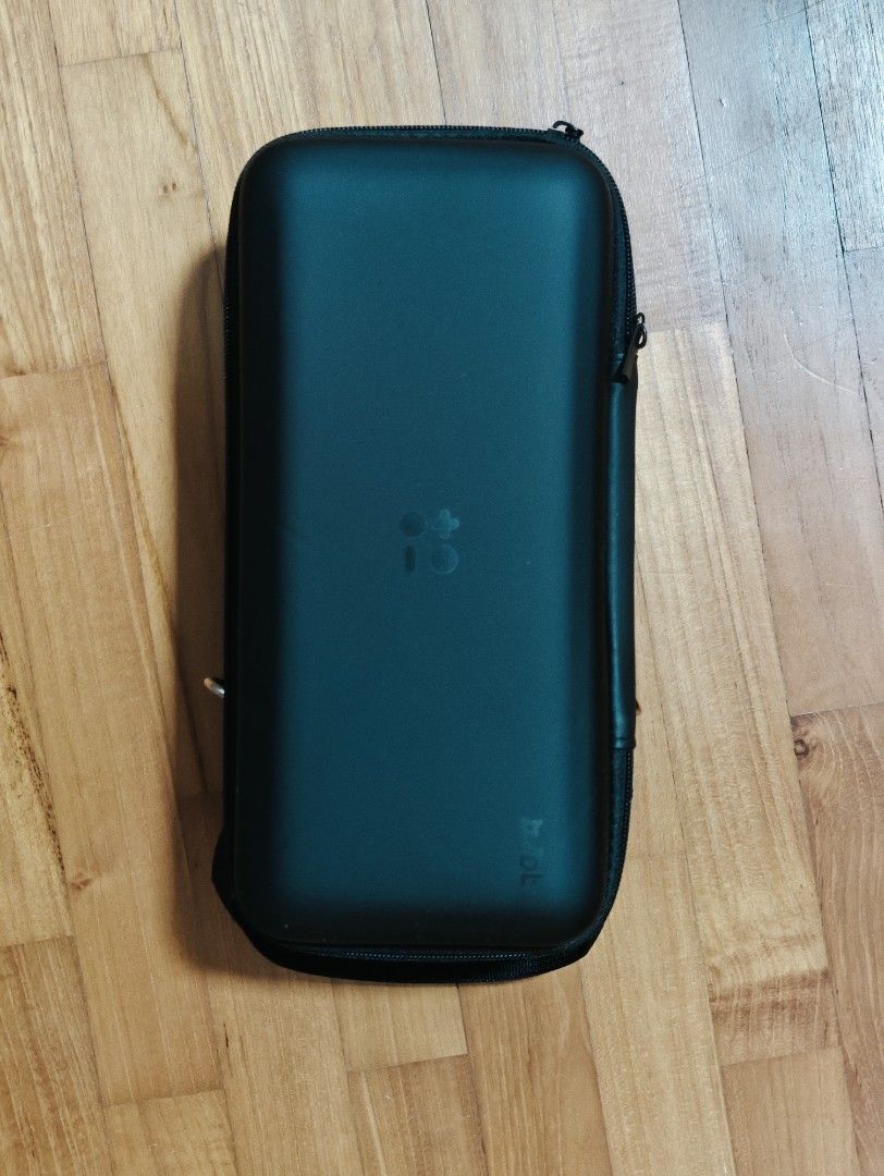 Switch Lite (Category: Nintendo) located in Singapore. Submitted by a7iii (Listing ID 1417618952, Image 1). Description: Hard-shell carrying case for a portable gaming console nintendp switch lite use..