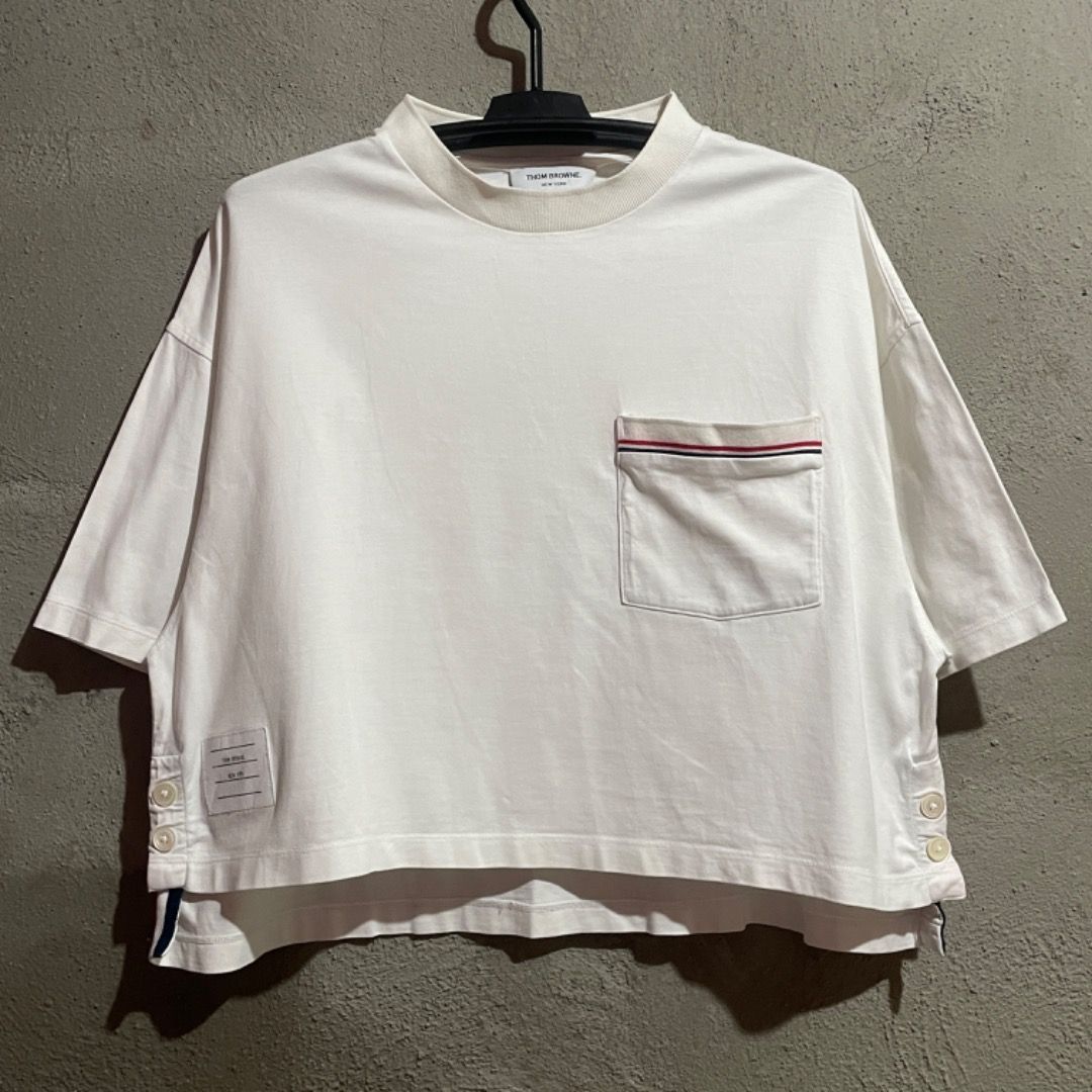 Thom Browne Oversided Croptop Tshirt (Category: Luxury Apparel) located in Bacolod City. Submitted by cast.archives (Listing ID 1417616552, Image 1). Description: Thom Browne Oversided Croptop Tshirt Authentic Tagged size: 38 Size: Large Condition: Very good Flaw: Need wash only.