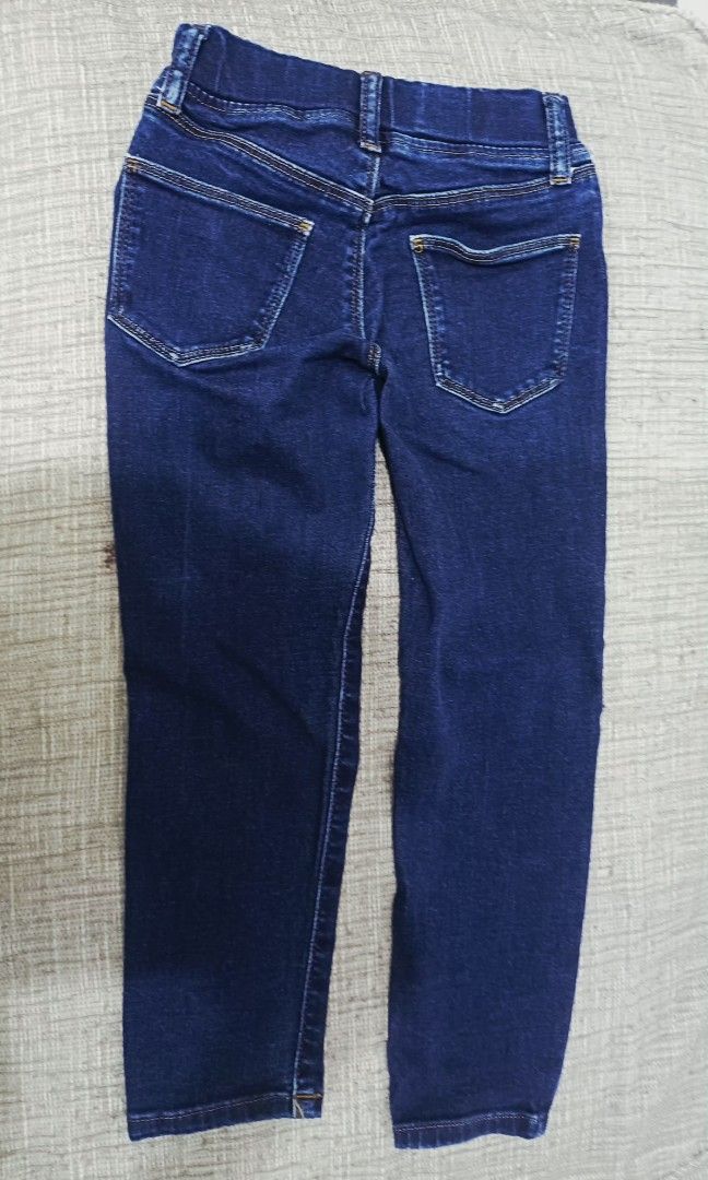 Uniqlo Kids' Jeans (Category: Babies & Kids Fashion) located in Taguig. Submitted by nethprelovedcorner (Listing ID 1403180119, Image 3). Description: - Dark wash jeans - Comfortable elastic waistband - Classic five-pocket design - Straight leg cut - Made of durable denim - Suitable for everyday wear - Versatile and easy to pair with different tops and shoes.