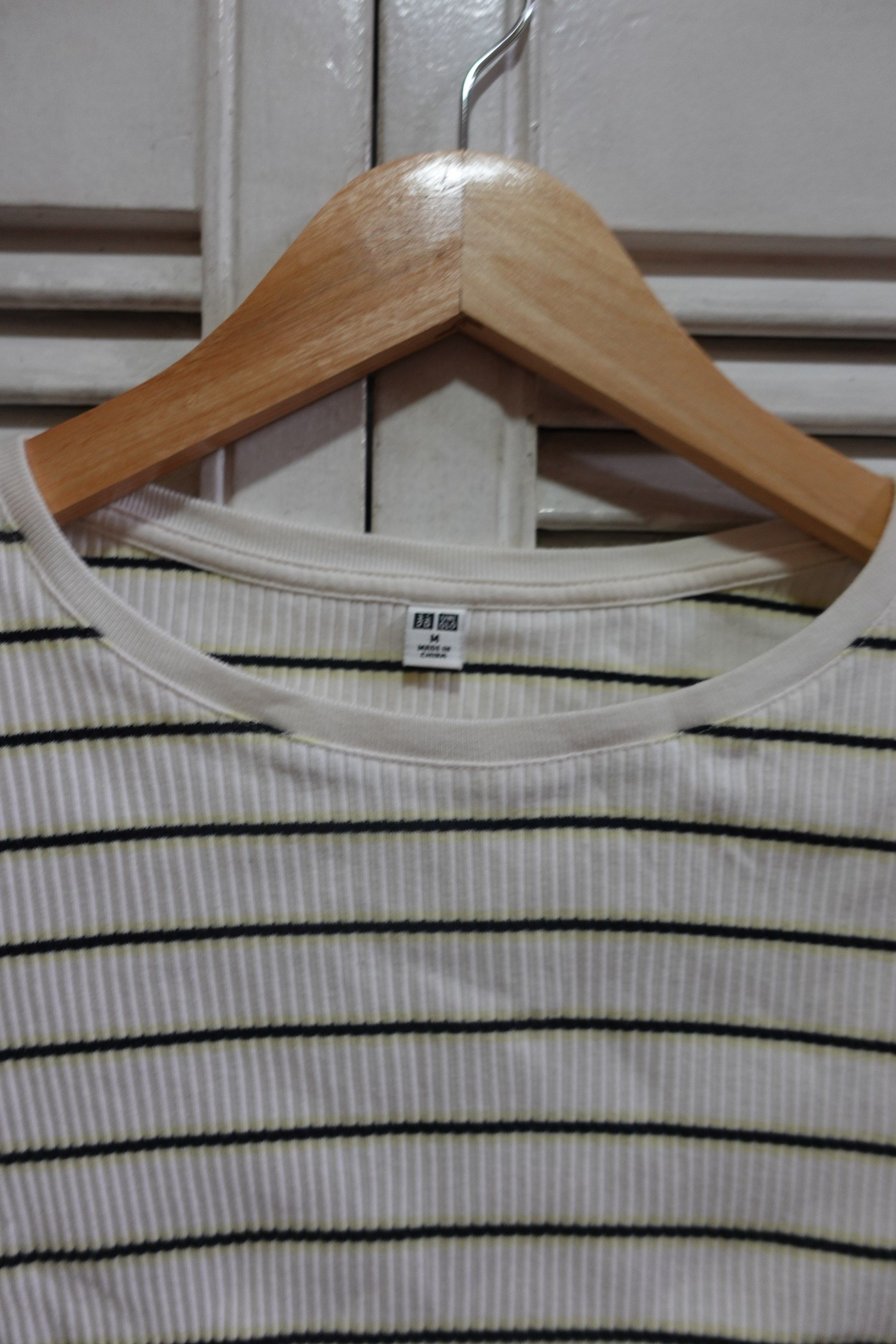 Uniqlo White Striped Crop Top (Category: Shirts) located in Marikina City. Submitted by mrgalc (Listing ID 1417759658, Image 2). Description: Uniqlo White Striped Crop Top Size: M Condition: Lightly used, no flaws.