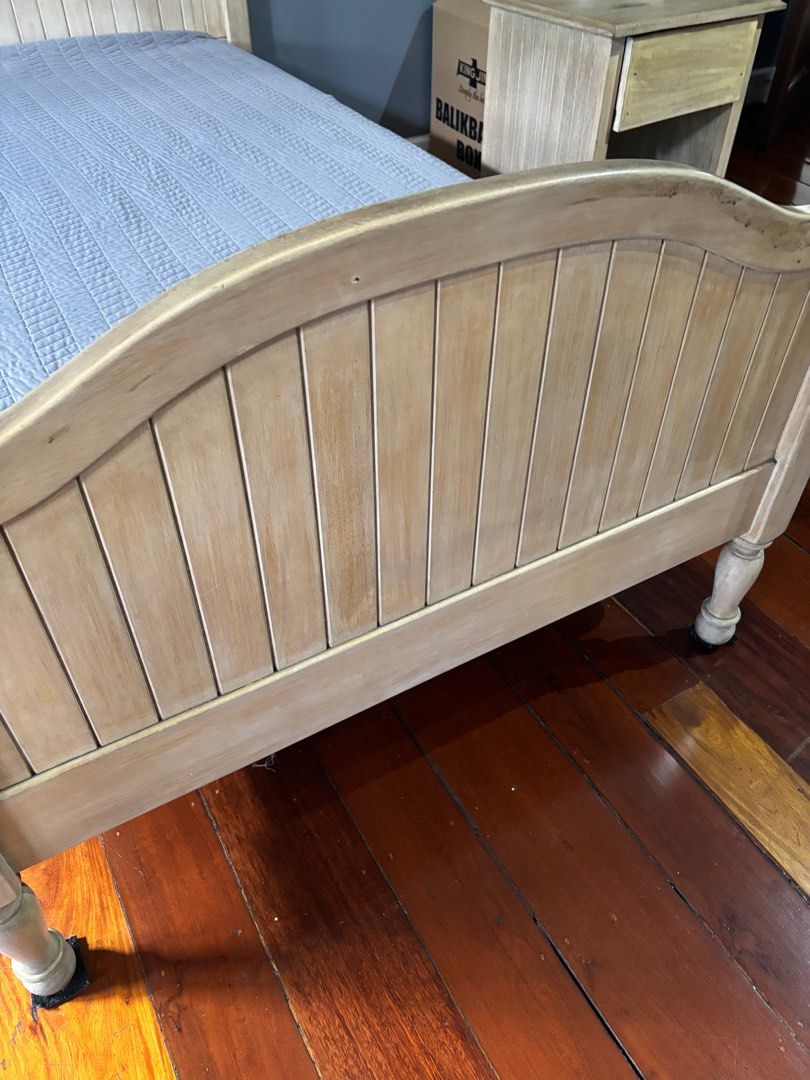 Wooden country style bed frame (Category: Bed Frames & Mattresses) located in Quezon City. Submitted by leacyril (Listing ID 1417615703, Image 3). Description: Solid wood with a light, slightly distressed finish . Vertical beadboard panels on the headboard and footboard with Rounded finials . Bed made by Facolare. Side dresser free .