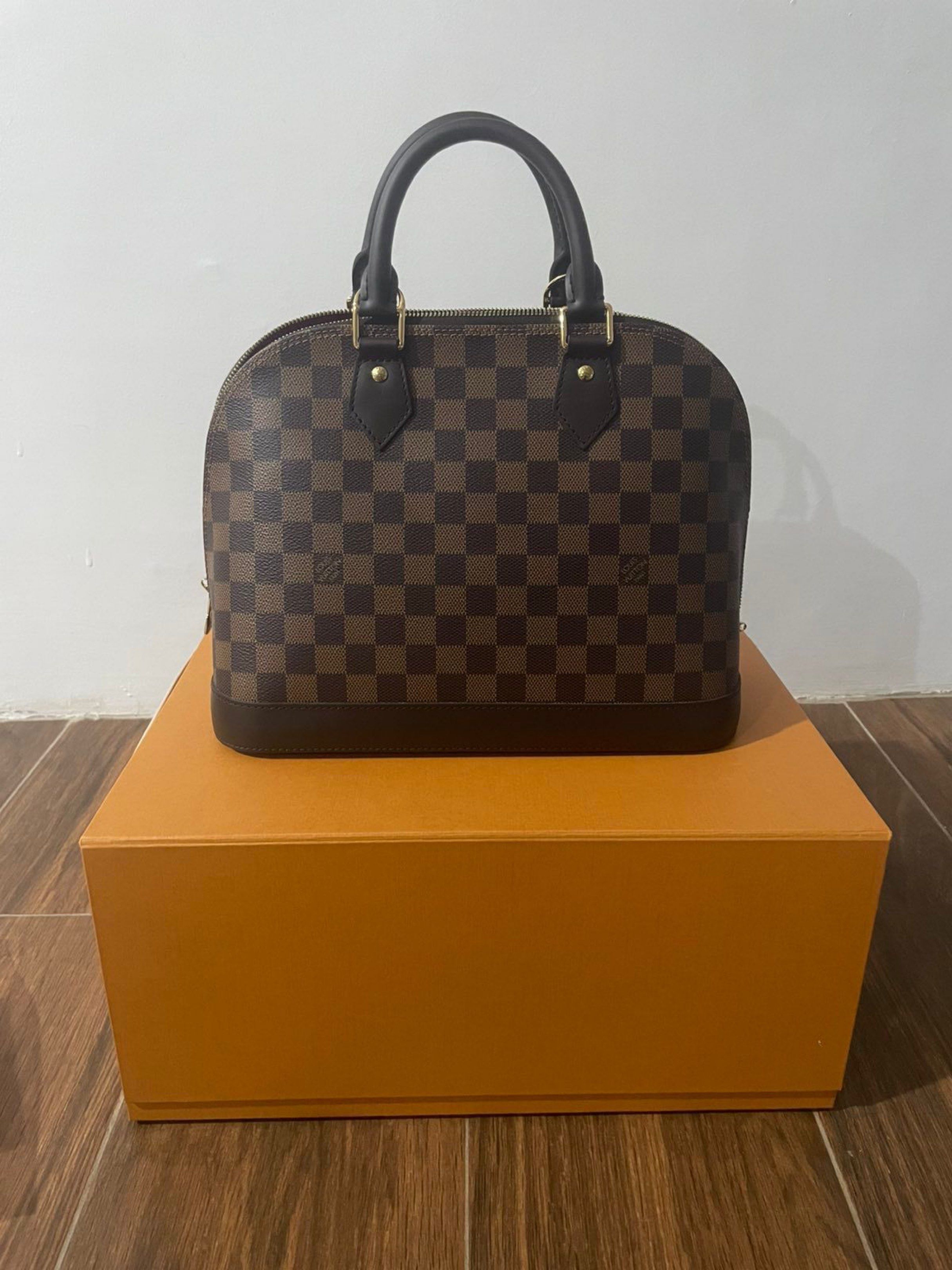 Alma Damier Ebene (Category: Luxury Bags & Wallets) located in Quezon City. Submitted by luxurybrokerph (Listing ID 1417882485, Image 1). Description: comes complete with receipt box paperbag lock and keys dustbag strap.