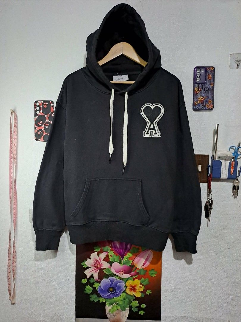 AMI Paris Black Hoodie (Category: Luxury Apparel) located in Manila. Submitted by yaseen_73 (Listing ID 1417824626, Image 1). Description: - AMI Paris hoodie Unisex - Made in Portugal - Large logo on chest - Size L for Men / XL - XXL for Women - Dimension : Armpit - Armpit 25 Lenght 25 - Heavy Weight - Black Color - Color Rate : 9.5/10 - With Minor/Minimal Sign of Usage - Oil Stain Visible - No Damage/No Defects - In Excellent Condition - Pre Own