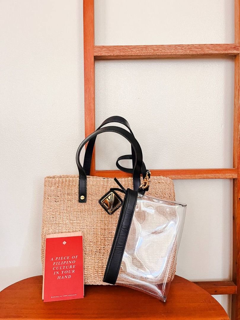 ARANAZ Celine Mini in Natural with Black Leather (Category: Tote Bags) located in Santa Rosa. Submitted by erimv (Listing ID 1417847390, Image 3). Description: About Celine Mini in Natural with Black Leather: A classic, elegant abaca bag crafted with luxurious tan leather straps. A small but mighty handbag with gold logo hardware (still has plastic protection) and black leather handle. Comes with a detachable pouch for your small necessities. Fea