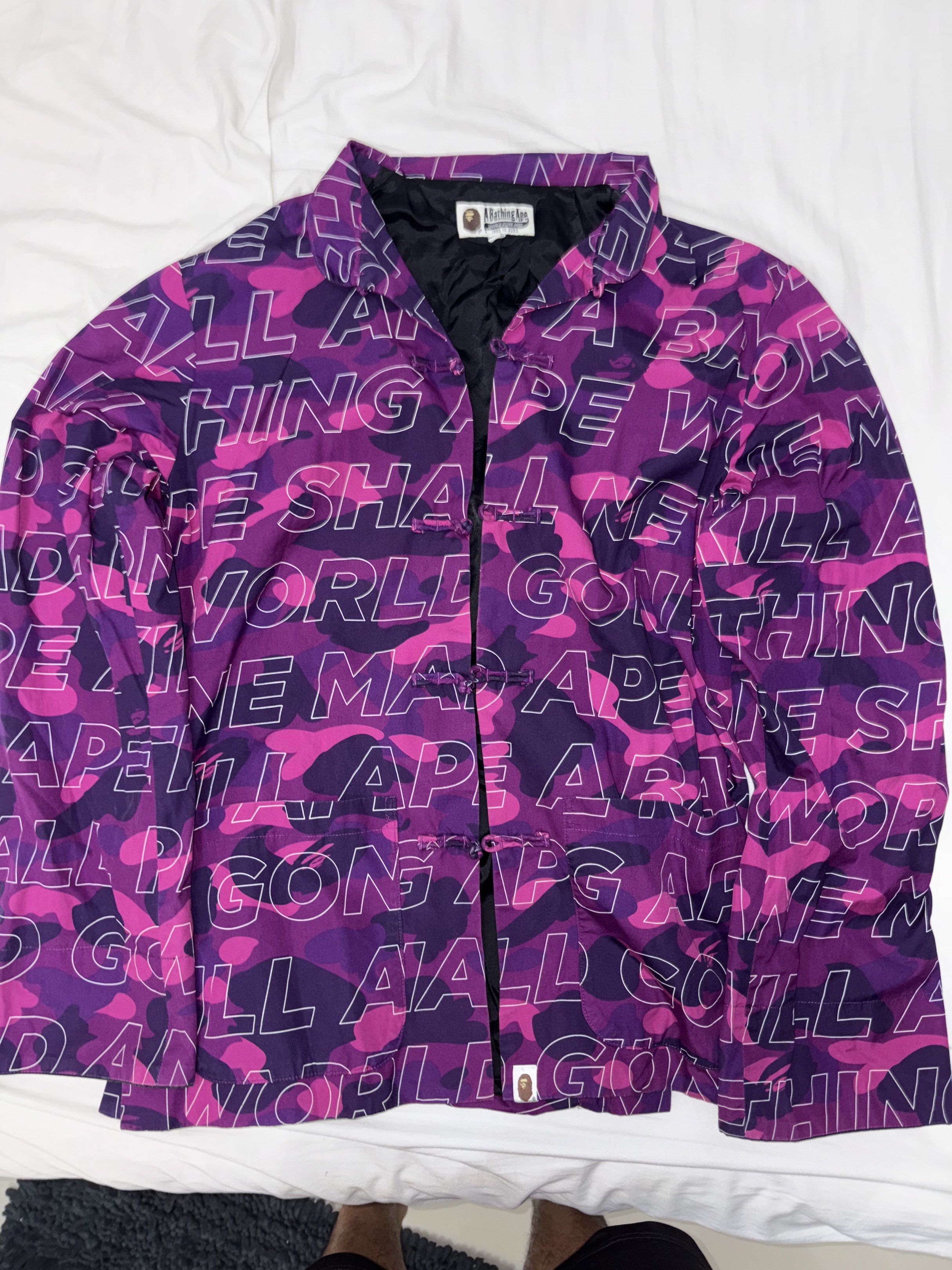 BAPE Purple Camo Jacket (Category: Coats, Jackets and Outerwear) located in Taguig. Submitted by homieplugph (Listing ID 1417996188, Image 1). Description: - Authentic BAPE jacket - Purple camo pattern - Size L - Iconic BAPE logo - Black lining - Unique button closure - High-quality materials.
