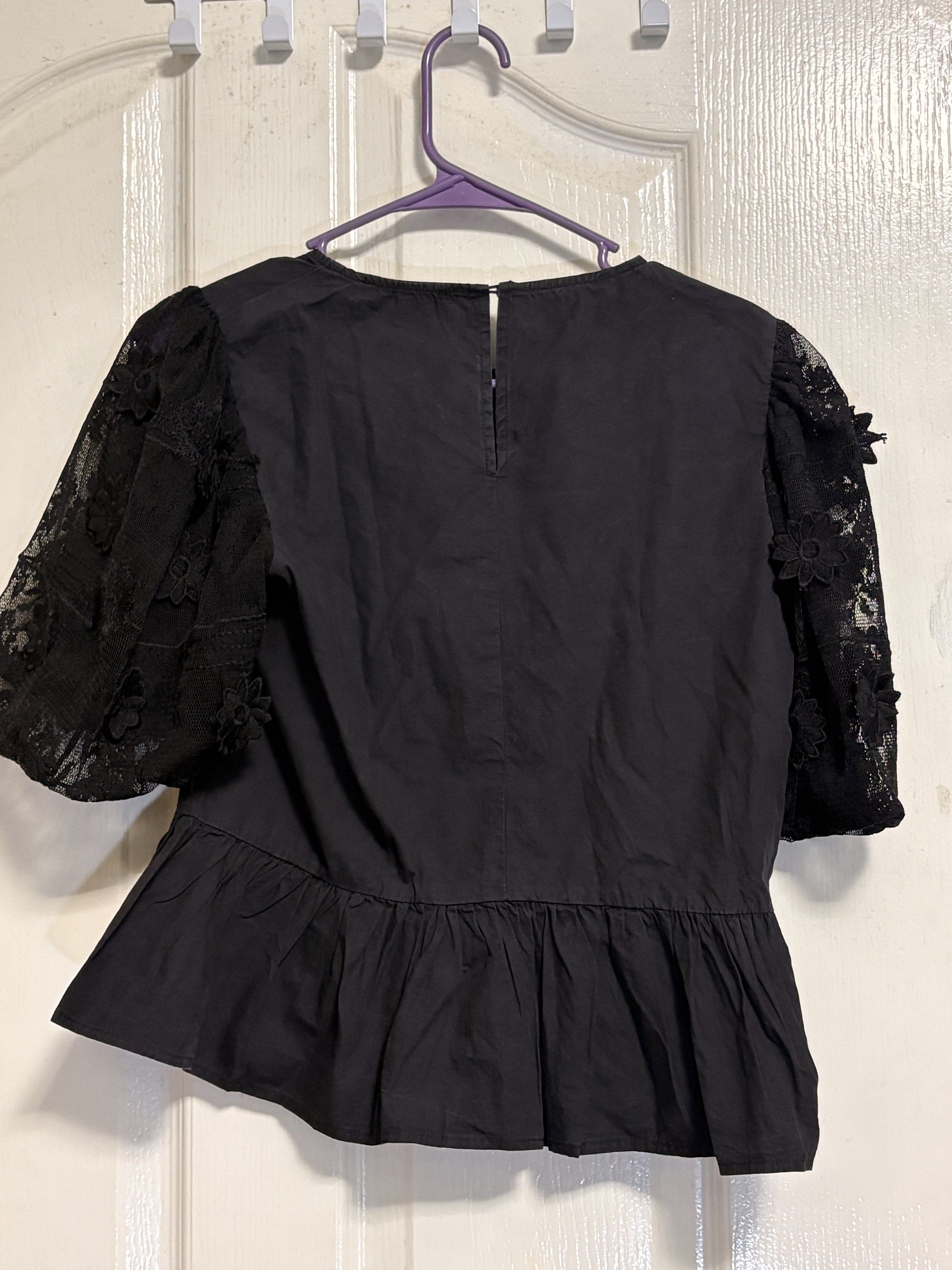 Black puffsleeve blouse (Category: Blouses) located in Manila. Submitted by multivers.closet (Listing ID 1417925650, Image 2). Description: medium to large.