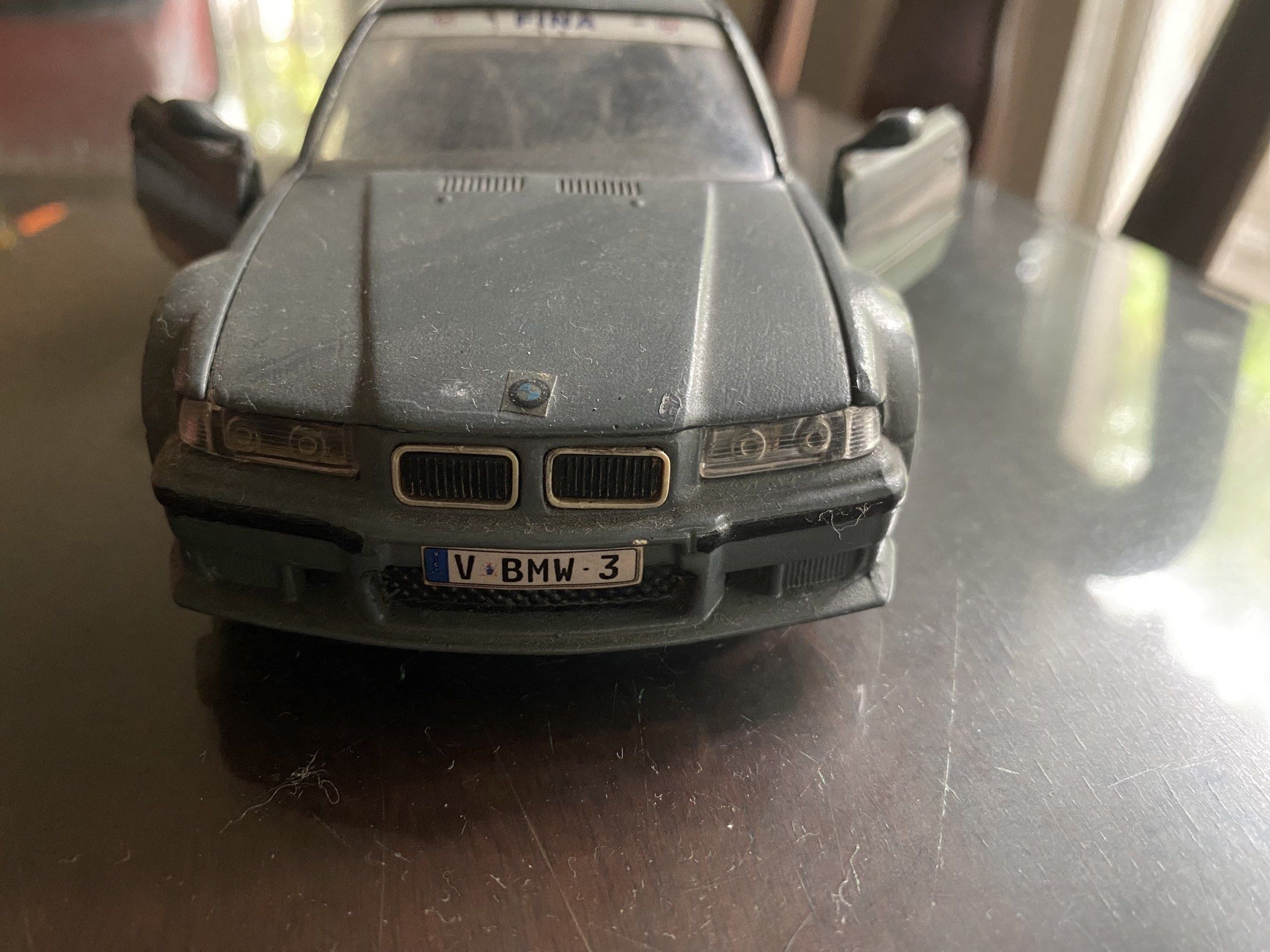 BMW M3 model (Category: Vehicle & Diecast Models) located in Pasig City. Submitted by ecochicsales (Listing ID 1417926336, Image 1). Description: - BMW 1:24 scale -Burago Italy - Gray color - Doors open - Collectible item - Layered condition.