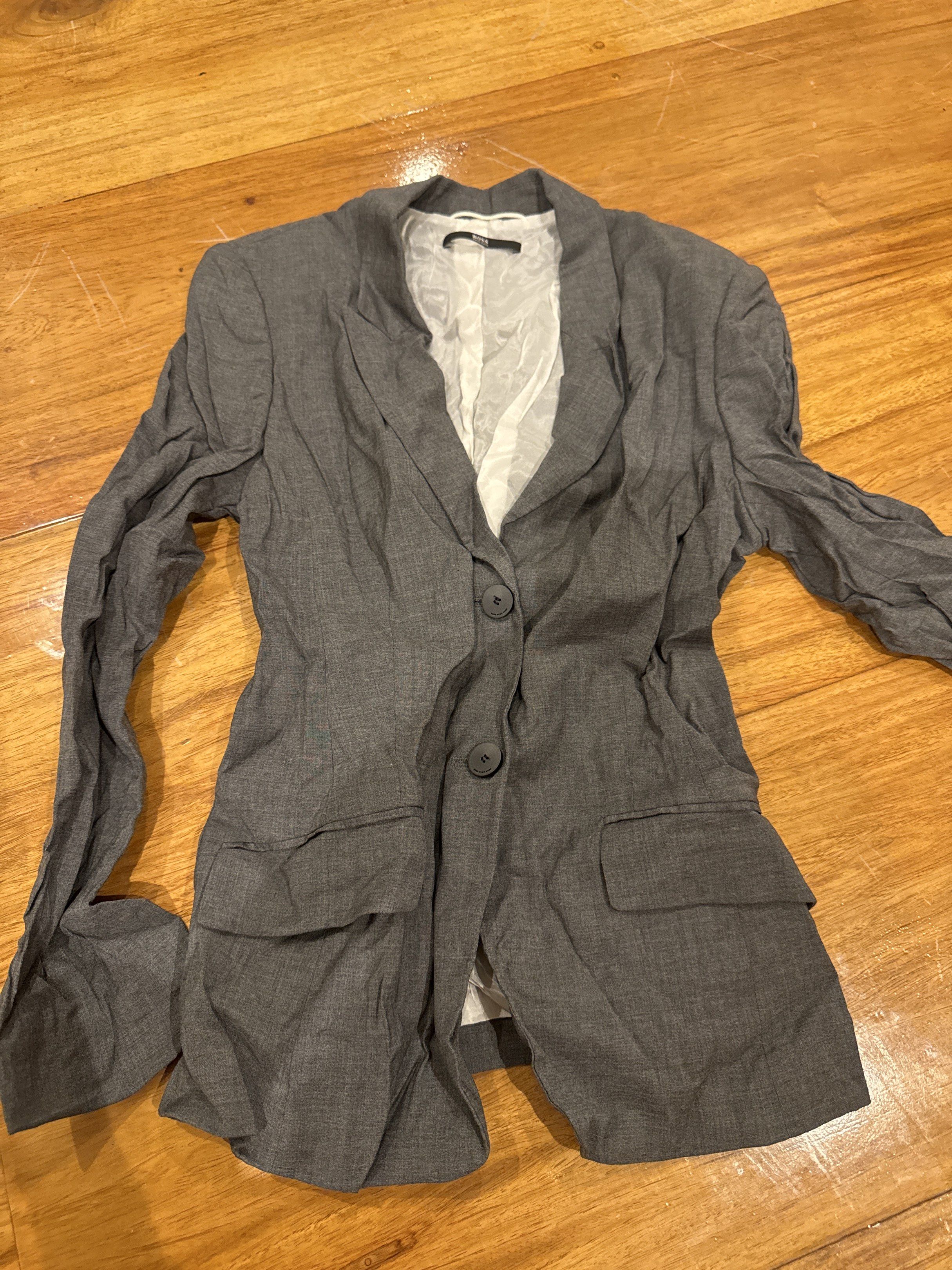 BOSS Gray Blazer (Category: Coats, Jackets and Outerwear) located in Manila. Submitted by eb.declutters (Listing ID 1417956943, Image 1). Description: - Gray BOSS blazer - Two-button closure - Two front pockets - White interior lining - Long sleeves - Brand tag visible - needs ironing.
