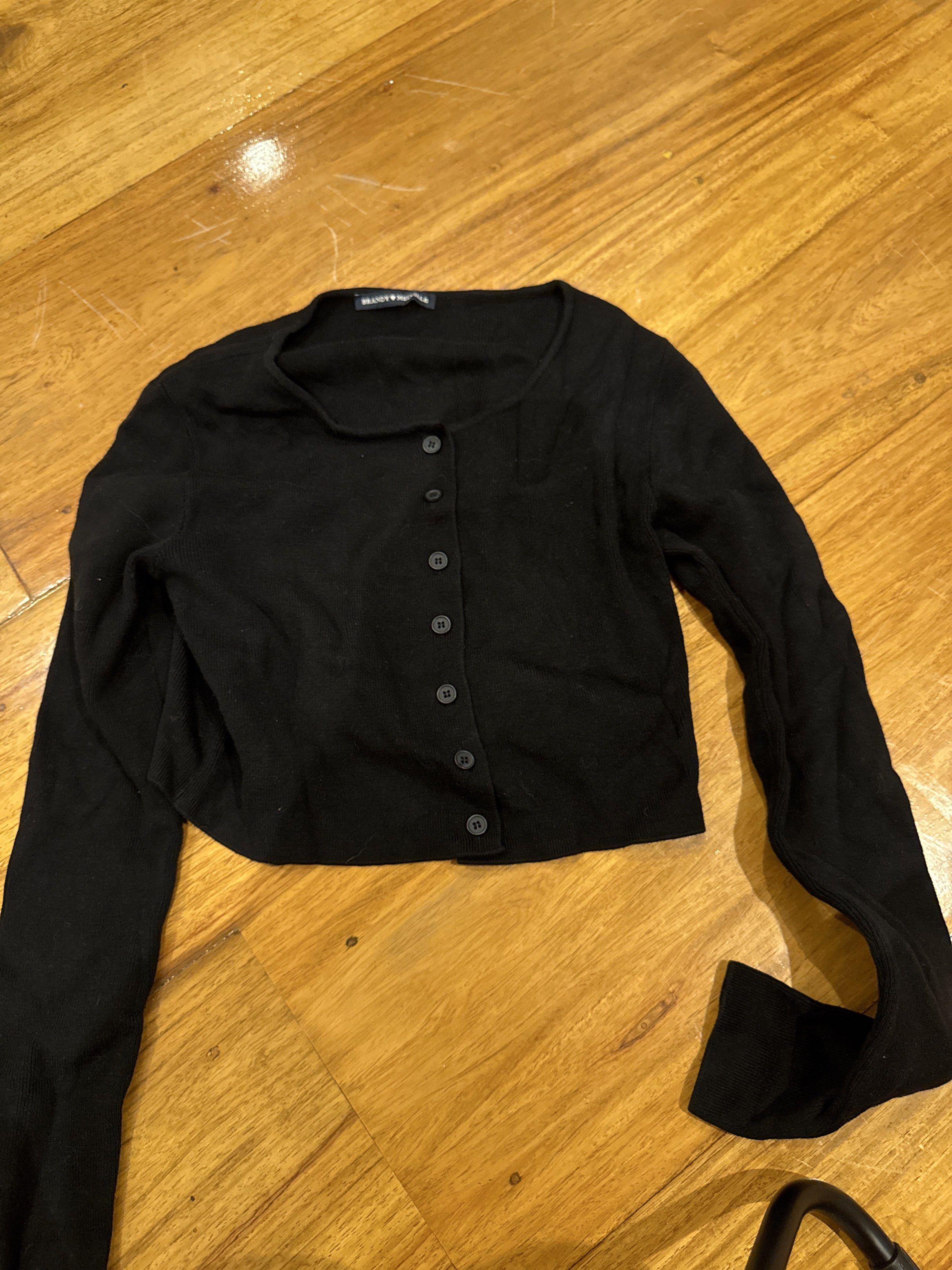 Brandy Melville Black Cardigan (Category: Coats, Jackets and Outerwear) located in Manila. Submitted by eb.declutters (Listing ID 1417955366, Image 1). Description: - Brandy Melville black cardigan - Cropped style - Button-down front - Long sleeves - Can be dressed up or down.