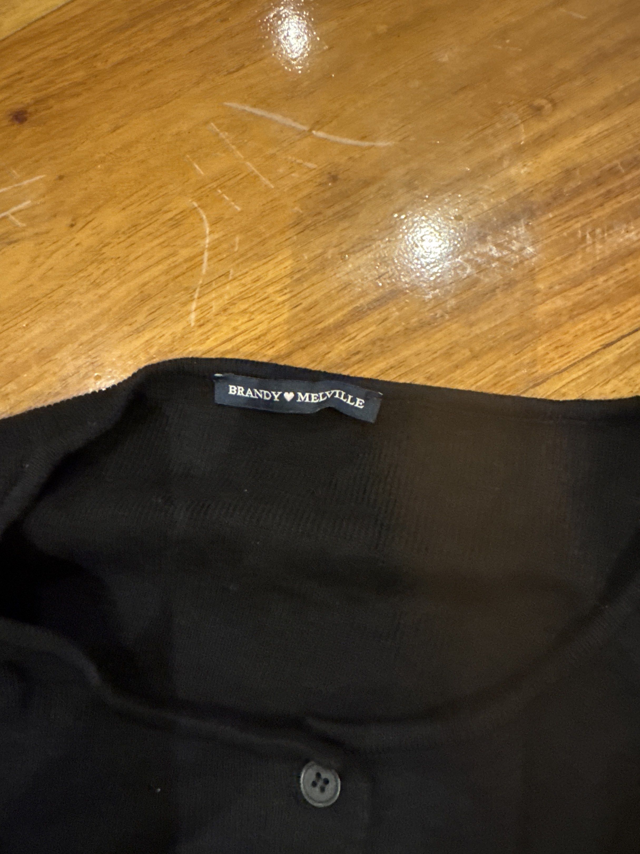 Brandy Melville Black Cardigan (Category: Coats, Jackets and Outerwear) located in Manila. Submitted by eb.declutters (Listing ID 1417955366, Image 2). Description: - Brandy Melville black cardigan - Cropped style - Button-down front - Long sleeves - Can be dressed up or down.
