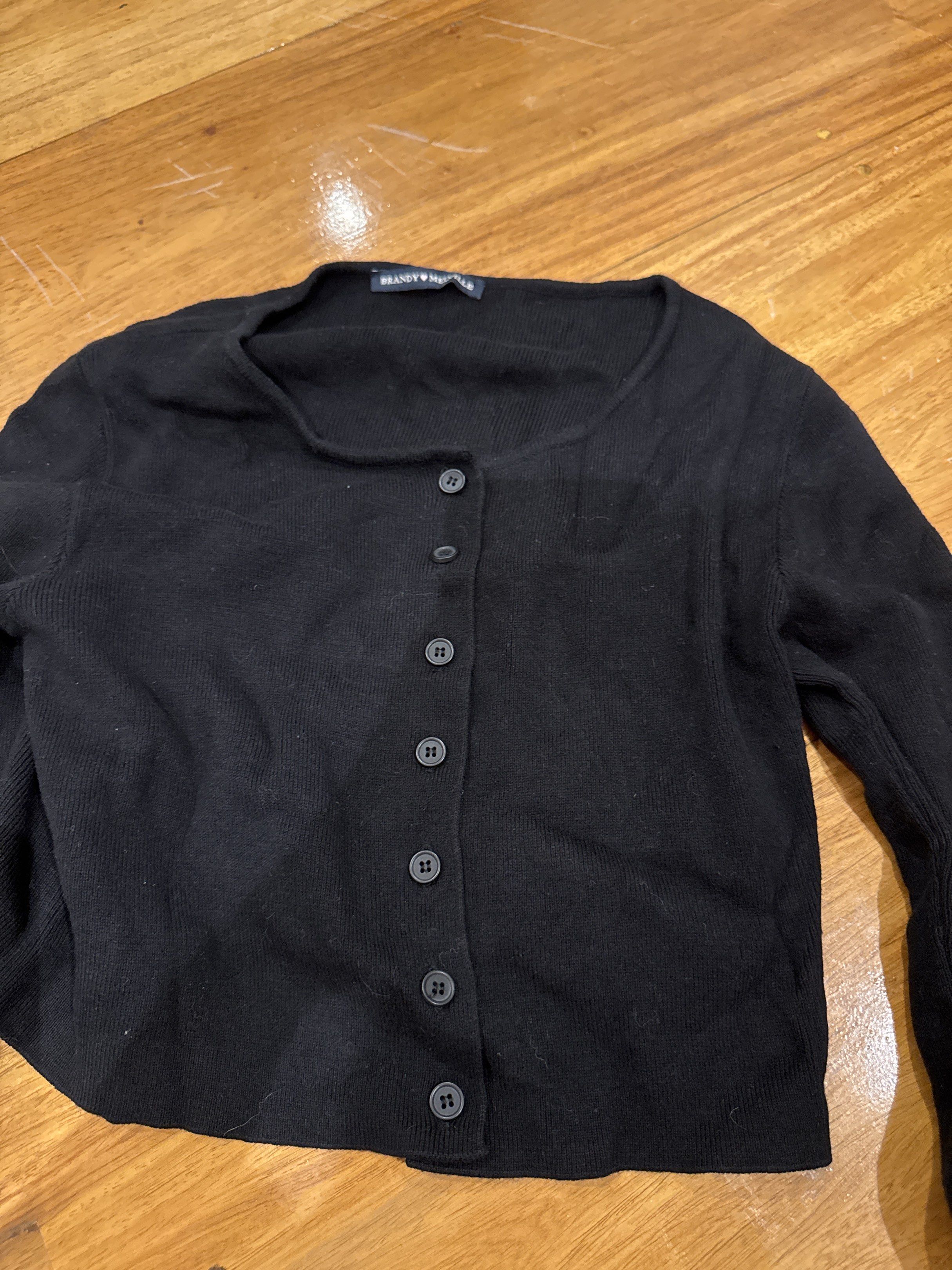 Brandy Melville Black Cardigan (Category: Coats, Jackets and Outerwear) located in Manila. Submitted by eb.declutters (Listing ID 1417955366, Image 3). Description: - Brandy Melville black cardigan - Cropped style - Button-down front - Long sleeves - Can be dressed up or down.