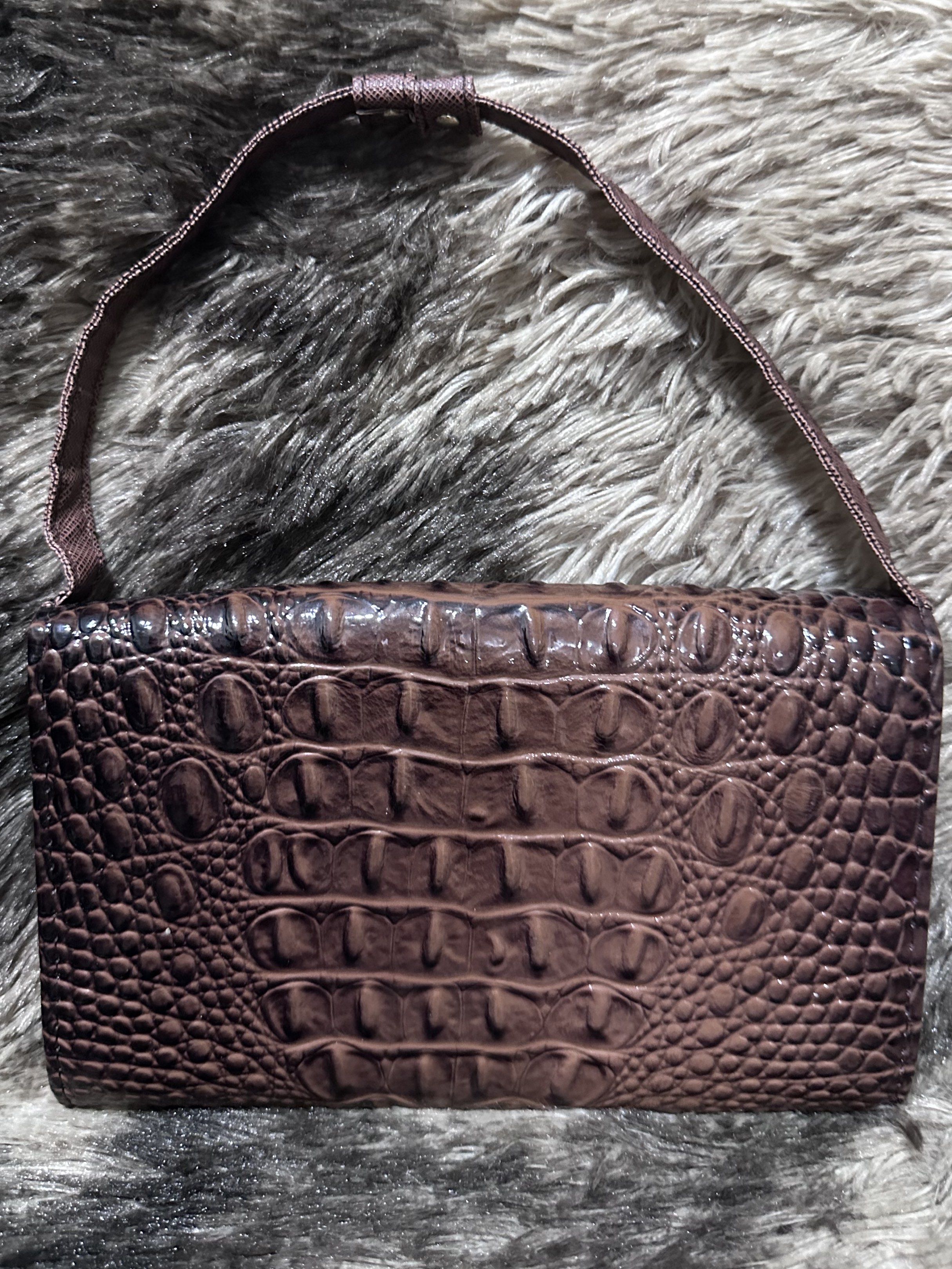 Brown Crocodile-Embossed Wallet Handbag (Category: Luxury Bags & Wallets) located in Manila. Submitted by shopaholic_gurl (Listing ID 1417969585, Image 3). Description: - Brown crocodile-embossed design - Rectangular shape with top handle - Interior with multiple compartments - Includes card slots and a zippered pocket - Magnetic closure - Metal corner accents - Interior color: Lighter brown.