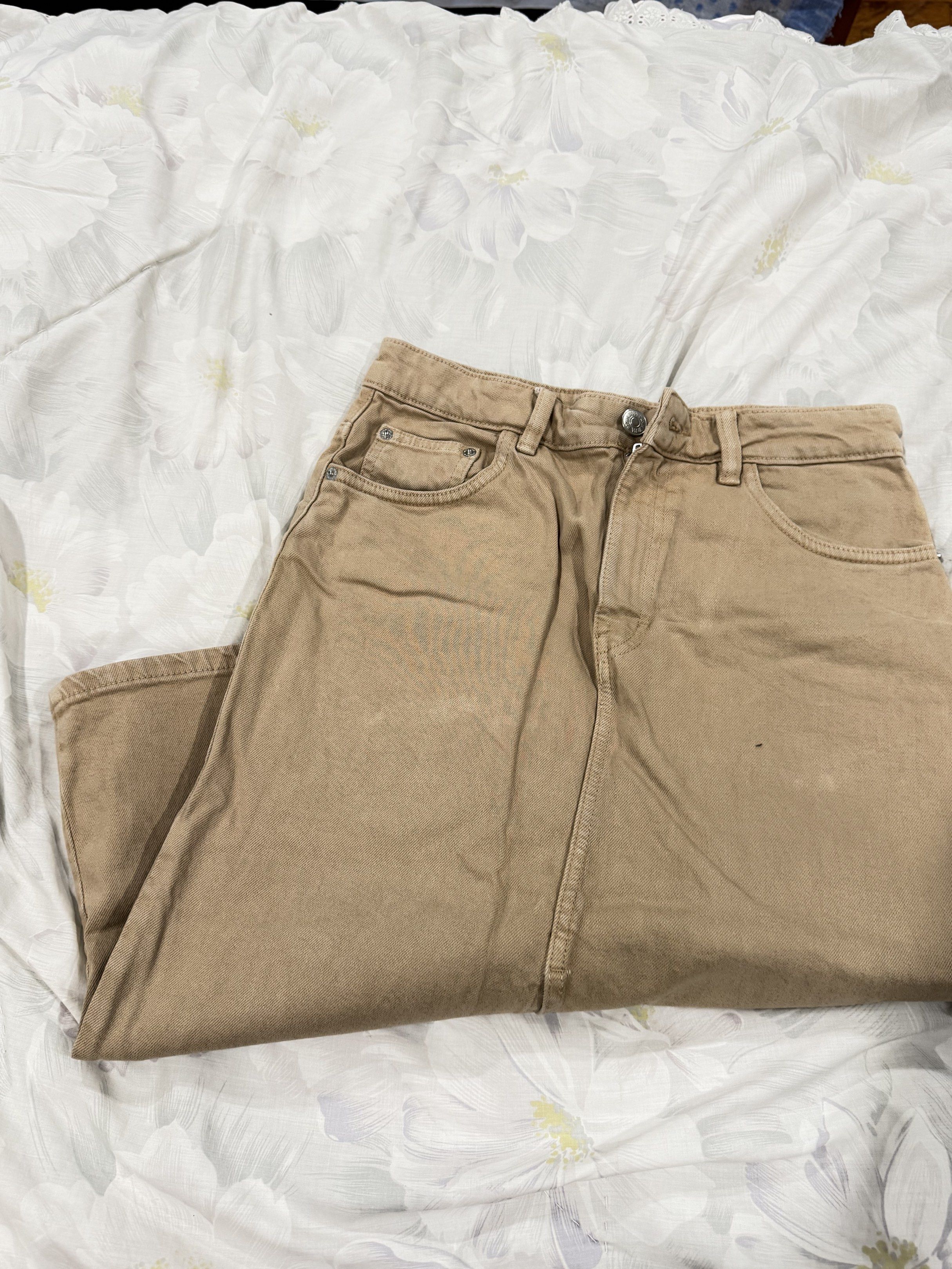 Brown/Beige Denim Midi Skirt (Category: Skirts) located in Del Monte. Submitted by bren.lim (Listing ID 1417976324, Image 2). Description: - Beige denim midi skirt - Front slit detail - Button and zipper closure - Front and back pockets - Sturdy denim material - High-waisted design - Ideal for casual outfits.