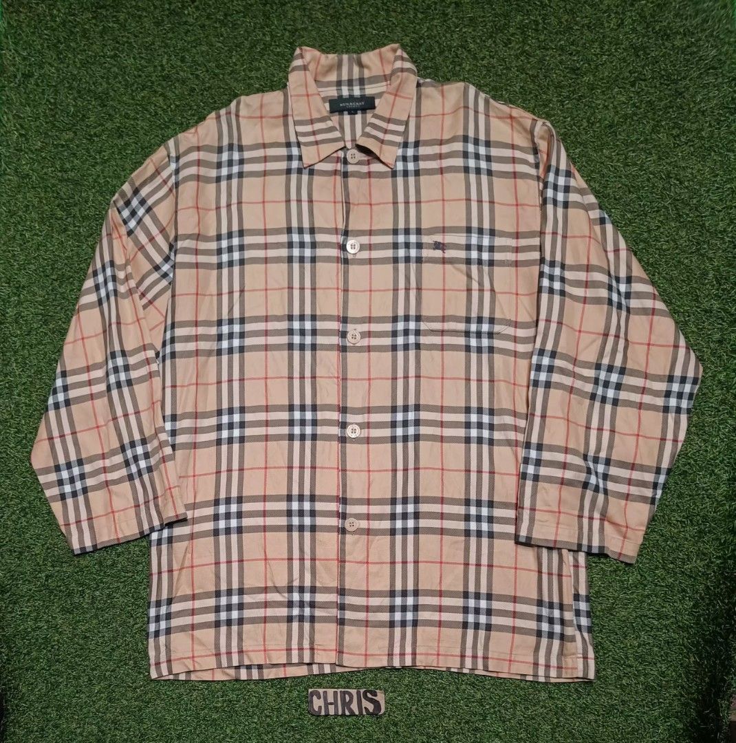 Burberry London Checkered Shirt - Large (Category: Tshirts & Polo Shirts ) located in Reina Mercedes. Submitted by SIRCHIVES (Listing ID 1417829500, Image 1). Description: - Authentic Burberry London shirt - Classic Burberry check pattern (beige, black, red) - Size: Large - Button-down style - Collared neckline - Chest pocket with button - Features Burberry London logo.