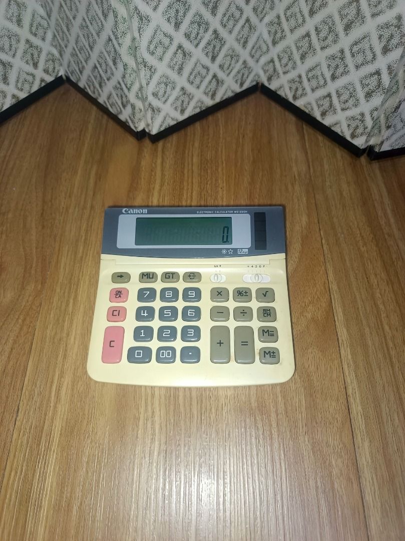 Canon WS-220H Electronic Calculator (Category: Office & Business Technology) located in Makati City. Submitted by nyxhemera26 (Listing ID 1418002557, Image 3). Description: Vintage Canon WS-220H Calculator - Solar powered - Features a display screen and function keys - Color: Beige and gray - Made in China - Estimated year: 1999 - Working condition.