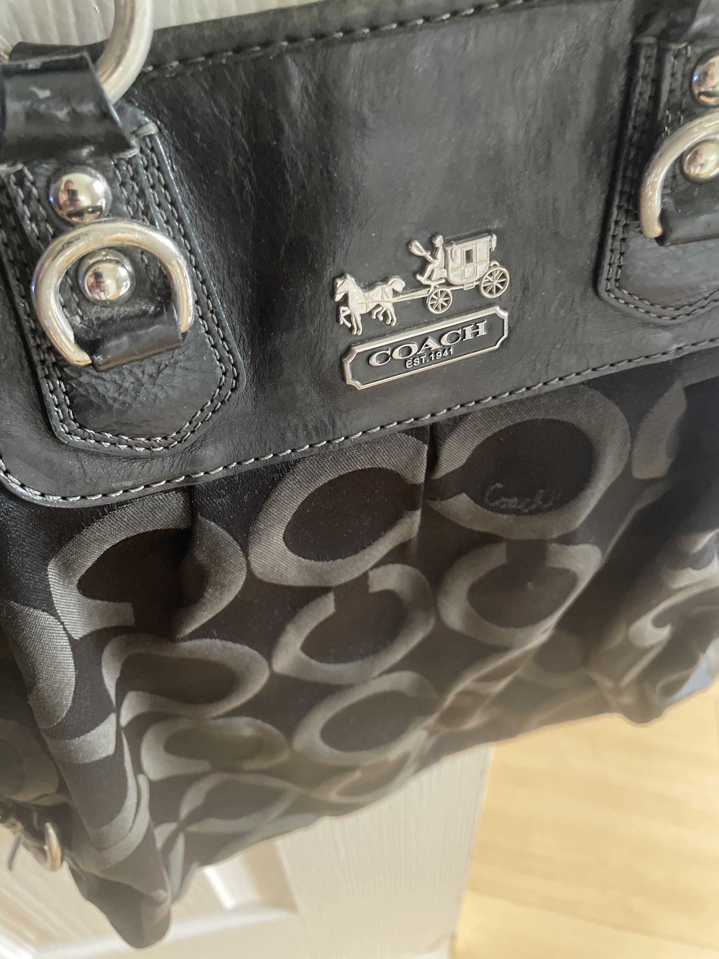 Coach Black Tote Bag (Category: Luxury Bags & Wallets) located in Manila. Submitted by mars1122334455 (Listing ID 1417841936, Image 2). Description: 100% authentic I bought this in San Francisco, CA actual retail Coach store, not outlet As you can see it is very well used, discoloration Back zipper is no longer working but I believe this bag can still be restored Top zipper has been replace 2x Hard for me to let go of this , and Ive used it for s