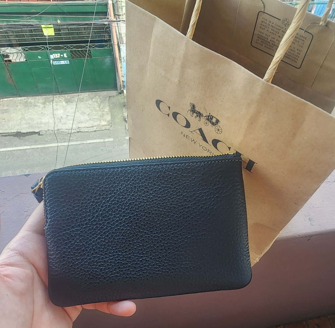 Coach Corner Zip Wristlet Vegan Leather (Category: Luxury Bags & Wallets) located in Pasay City. Submitted by juno_raph (Listing ID 1417937315, Image 2). Description: - Authentic Coach wristlet - Color: Black - Includes original Coach paper bag and tags - Pebbled leather texture - Vegan Leather - RFS: Extra - Brand new from US; never used - Negotiable .