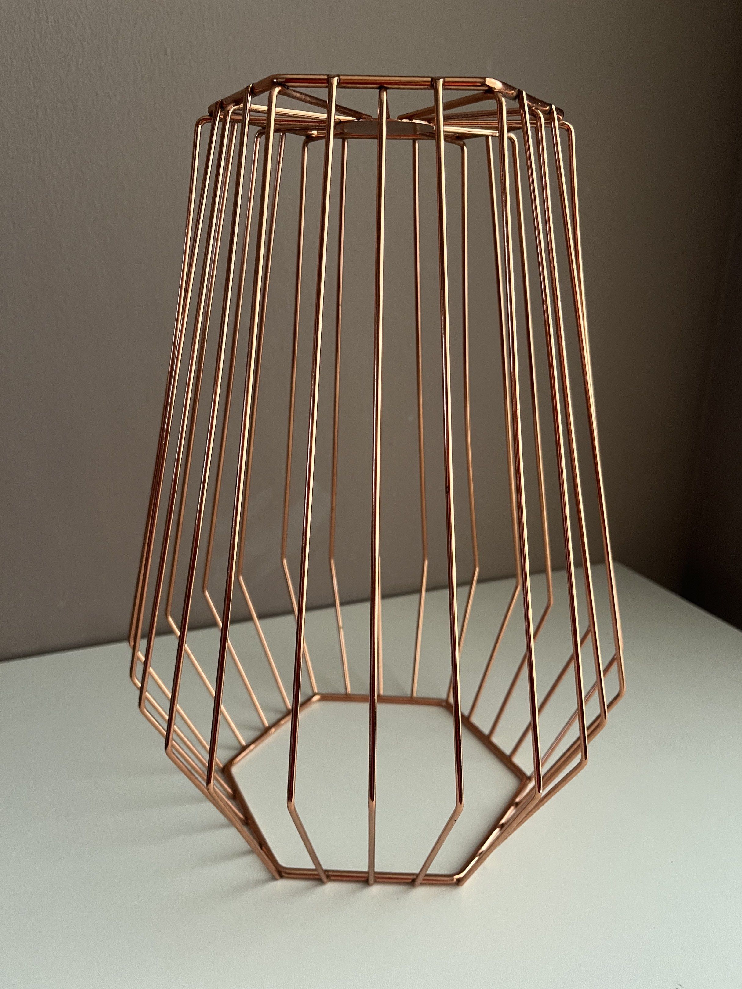 Copper Wire Geometric Basket (Category: Storage Boxes & Baskets) located in Quezon City. Submitted by littleparties (Listing ID 1417954238, Image 2). Description: - Geometric copper wire basket - Unique shape with open top - Sturdy base - Ideal for fruits, small items, or decor - Modern and elegant design - Lightweight and easy to move.
