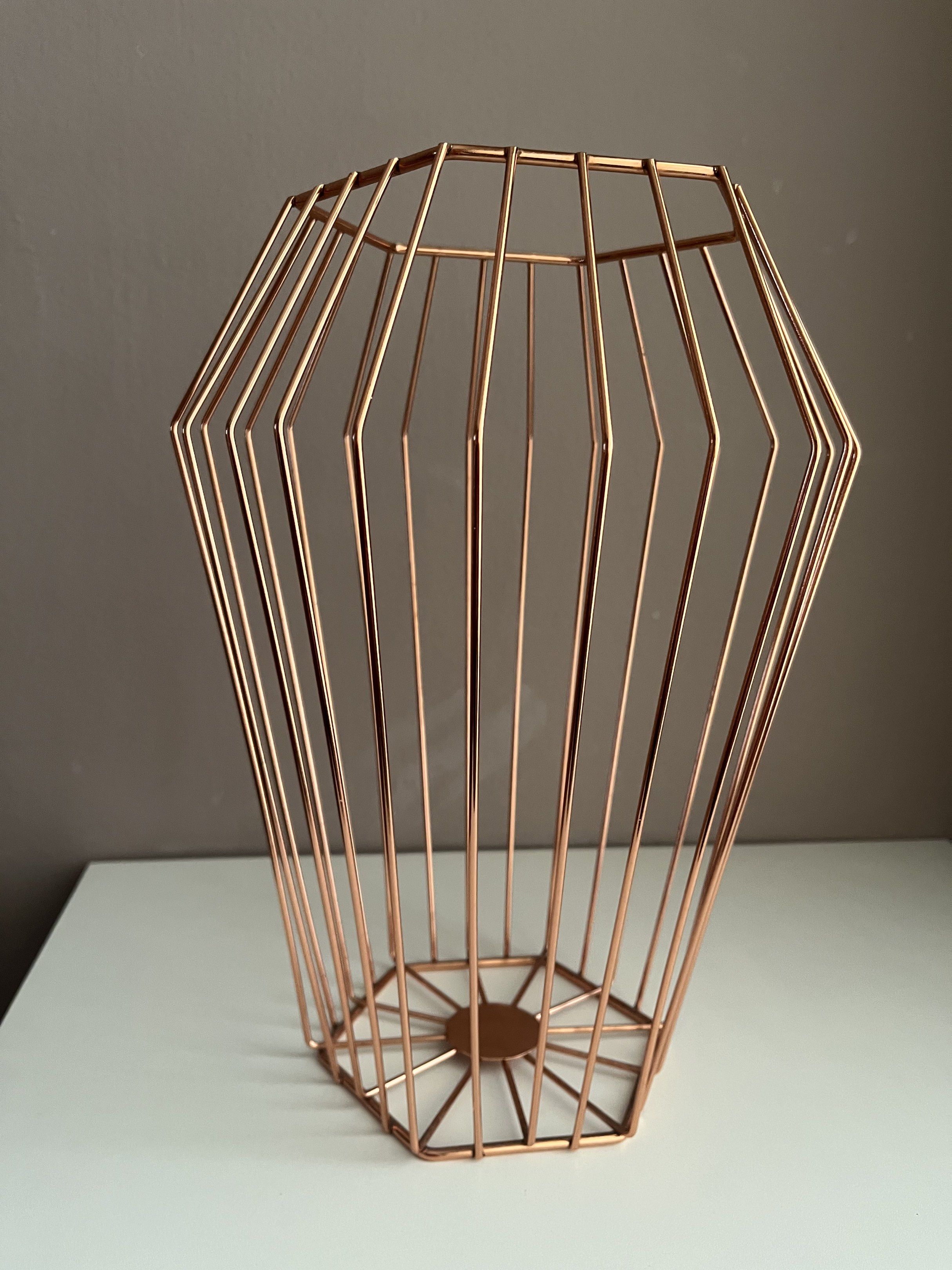 Copper Wire Geometric Basket (Category: Storage Boxes & Baskets) located in Quezon City. Submitted by littleparties (Listing ID 1417954238, Image 1). Description: - Geometric copper wire basket - Unique shape with open top - Sturdy base - Ideal for fruits, small items, or decor - Modern and elegant design - Lightweight and easy to move.