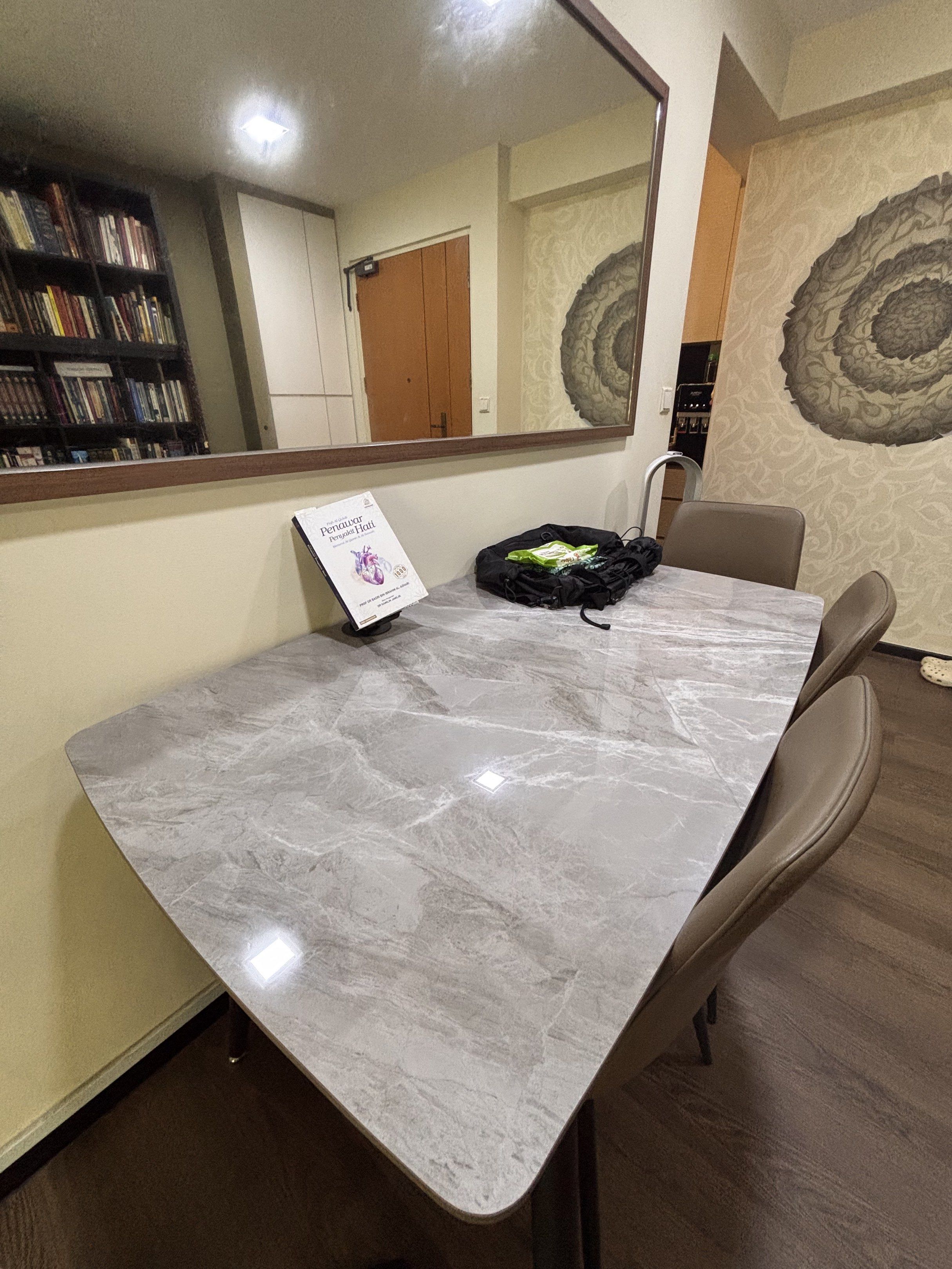 Dining table (Category: Tables & Sets) located in Singapore. Submitted by icedcoffeetea (Listing ID 1417355459, Image 3). Description: What you see is what you get 130cm by 79cm The table top is Light grey colour sintered stone alike Message me if want closer look All four chairs included Fast deal $100 Arrange own delivery.