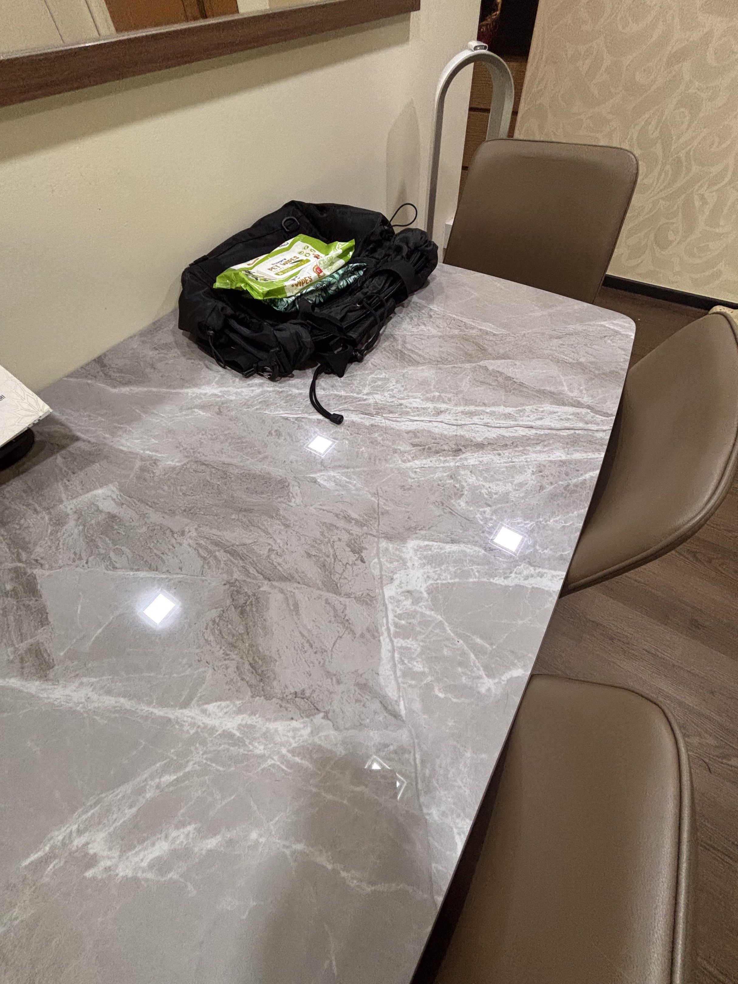 Dining table (Category: Tables & Sets) located in Singapore. Submitted by icedcoffeetea (Listing ID 1417355459, Image 2). Description: What you see is what you get 130cm by 79cm The table top is Light grey colour sintered stone alike Message me if want closer look All four chairs included Fast deal $100 Arrange own delivery.