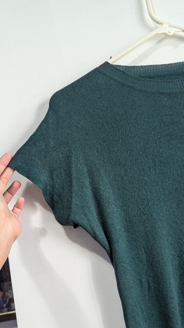 Emerald Green Knit Short Sleeve Top (Category: Blouses) located in Marikina City. Submitted by mlektea (Listing ID 1417860495, Image 3). Description: - Round neck - Short sleeves - Fitted design - Ribbed texture - Solid green color - Knit material - Unique sleeve cut - Ribbed hemline - Fits S-M frame - Nice color in actual! Lucky color pa yata this yr haha.