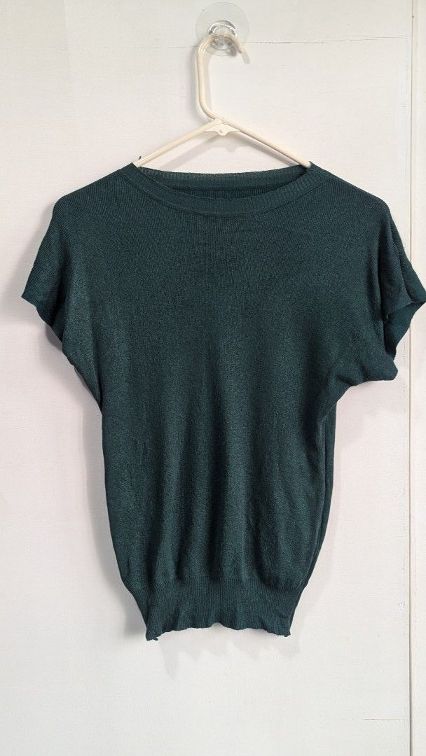 Emerald Green Knit Short Sleeve Top (Category: Blouses) located in Marikina City. Submitted by mlektea (Listing ID 1417860495, Image 1). Description: - Round neck - Short sleeves - Fitted design - Ribbed texture - Solid green color - Knit material - Unique sleeve cut - Ribbed hemline - Fits S-M frame - Nice color in actual! Lucky color pa yata this yr haha.