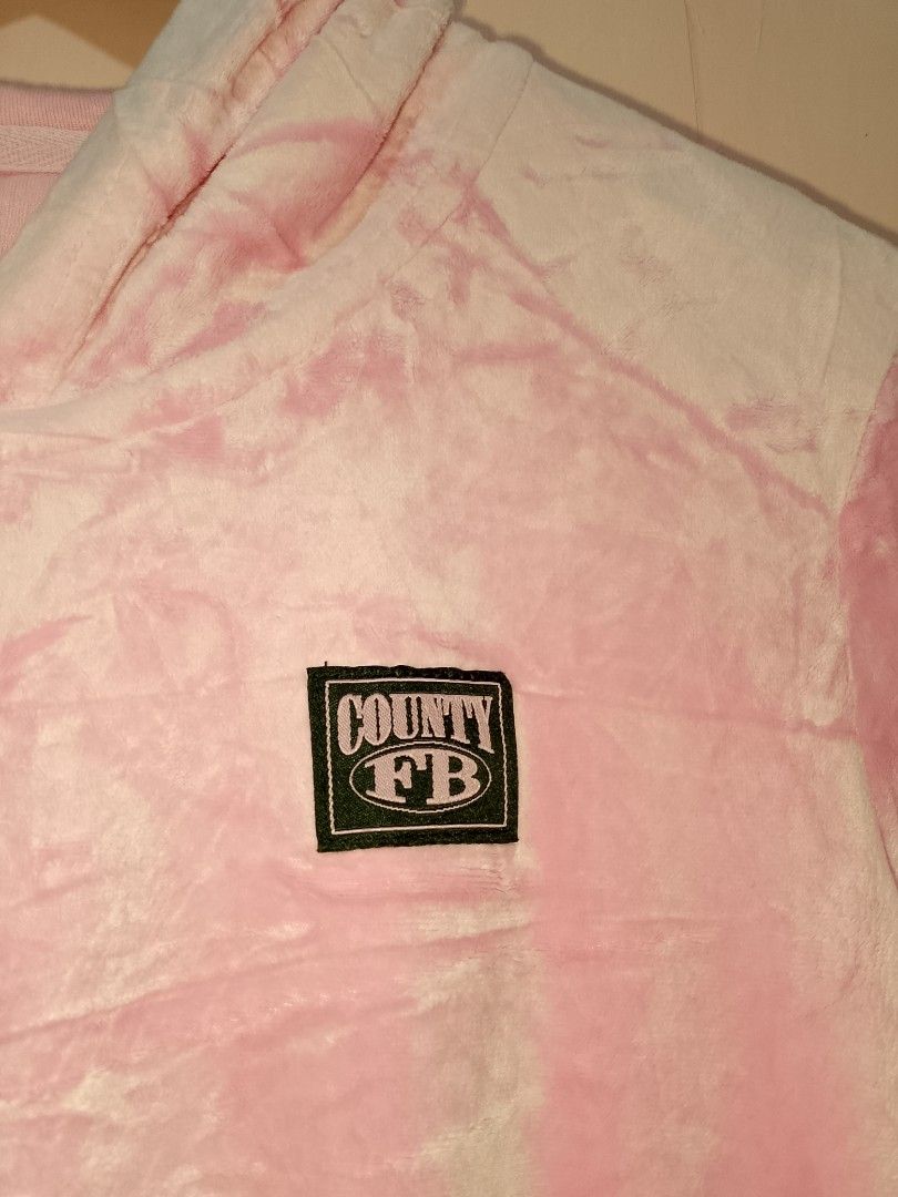 FB county Velour Hoodie XS (Category: Coats, Jackets and Outerwear) located in General Trias. Submitted by elmerafelix-42143 (Listing ID 1417910044, Image 2). Description: - County FB pink velour hoodie - Size: XS - Dimensions W 18 L 21 - Features a zip-up front and hood - Includes brand logo patch - Made of soft, comfortable velour - Perfect for casual wear.