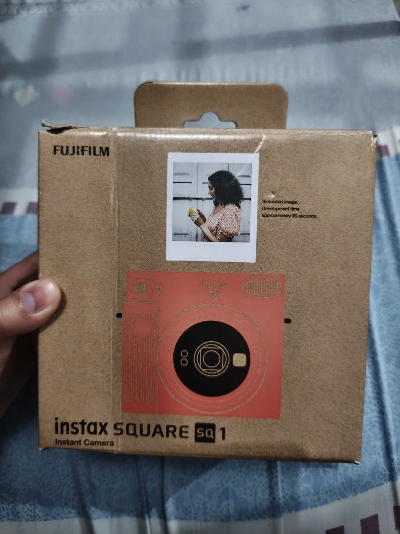 Fujifilm Instax Square SQ1 Instant Camera (Category: Cameras) located in Manila. Submitted by r_declutters (Listing ID 1417852110, Image 1). Description: - Fujifilm Instax Square SQ1 instant camera (Terracota Orange) - Includes original box, manual, and accessories - Designed for square format photos - Features a built-in flash - Simple and user-friendly design - Ready to capture instant memories.