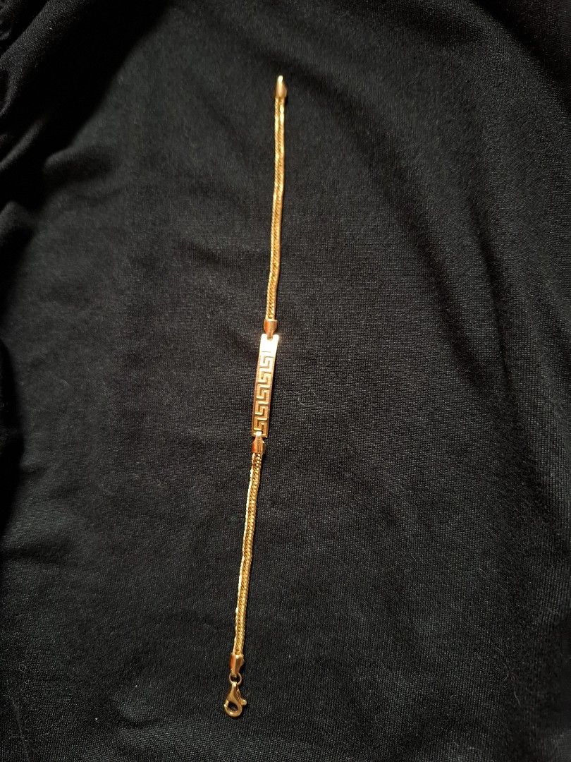 Gold Bracelet with Greek Key Design (Category: Bracelets) located in Bulacan. Submitted by firsthand_personalstuff (Listing ID 1417839889, Image 2). Description: 18K Elegant gold bracelet featuring a distinctive Greek key design on a rectangular centerpiece. The bracelet has a chain and a secure clasp. A stylish accessory suitable for everyday wear or special occasions. size - 7" 3gram 7800/gram.