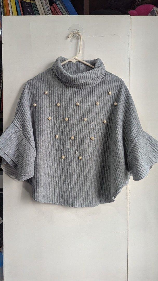Gray Turtleneck Sweater with Pearl Embellishments (Category: Longsleeves) located in Marikina City. Submitted by mlektea (Listing ID 1417859347, Image 3). Description: - Gray turtleneck sweater - Features bell sleeves - Adorned with pearl embellishments - Ribbed texture - Comfortable and stylish - Super cute in actual, pang OOTD sa winter trips ✨ - Fits M-L frame. I am medium frame and I wore this oversized. - May konting damage lang sa harap as 