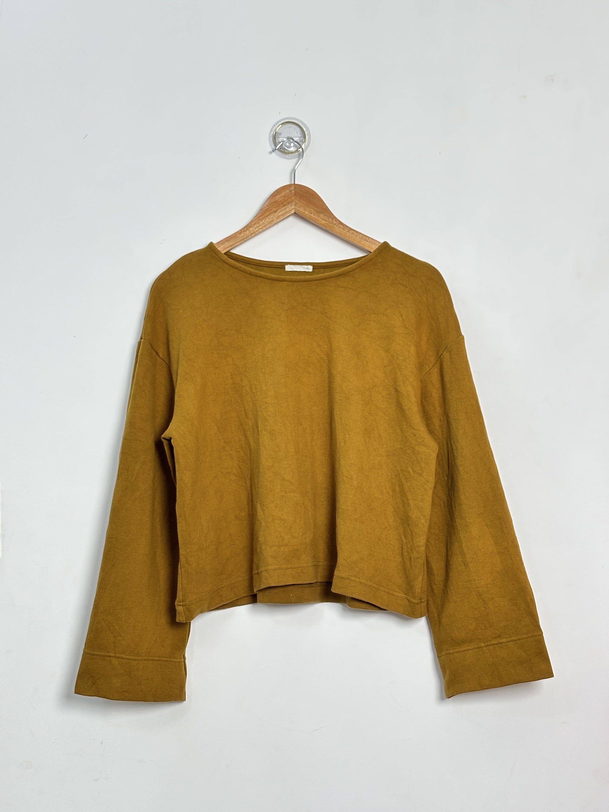 GU Mustard Yellow Long Sleeve Top (Category: Blouses) located in Malilipot. Submitted by brevsthrift (Listing ID 1417822777, Image 1). Description: - Mustard yellow long sleeve top - Brand: GU - Features a round neckline - Wide sleeves - Made of soft, comfortable material - Perfect for casual wear - Excellent condition - W23 L21 .