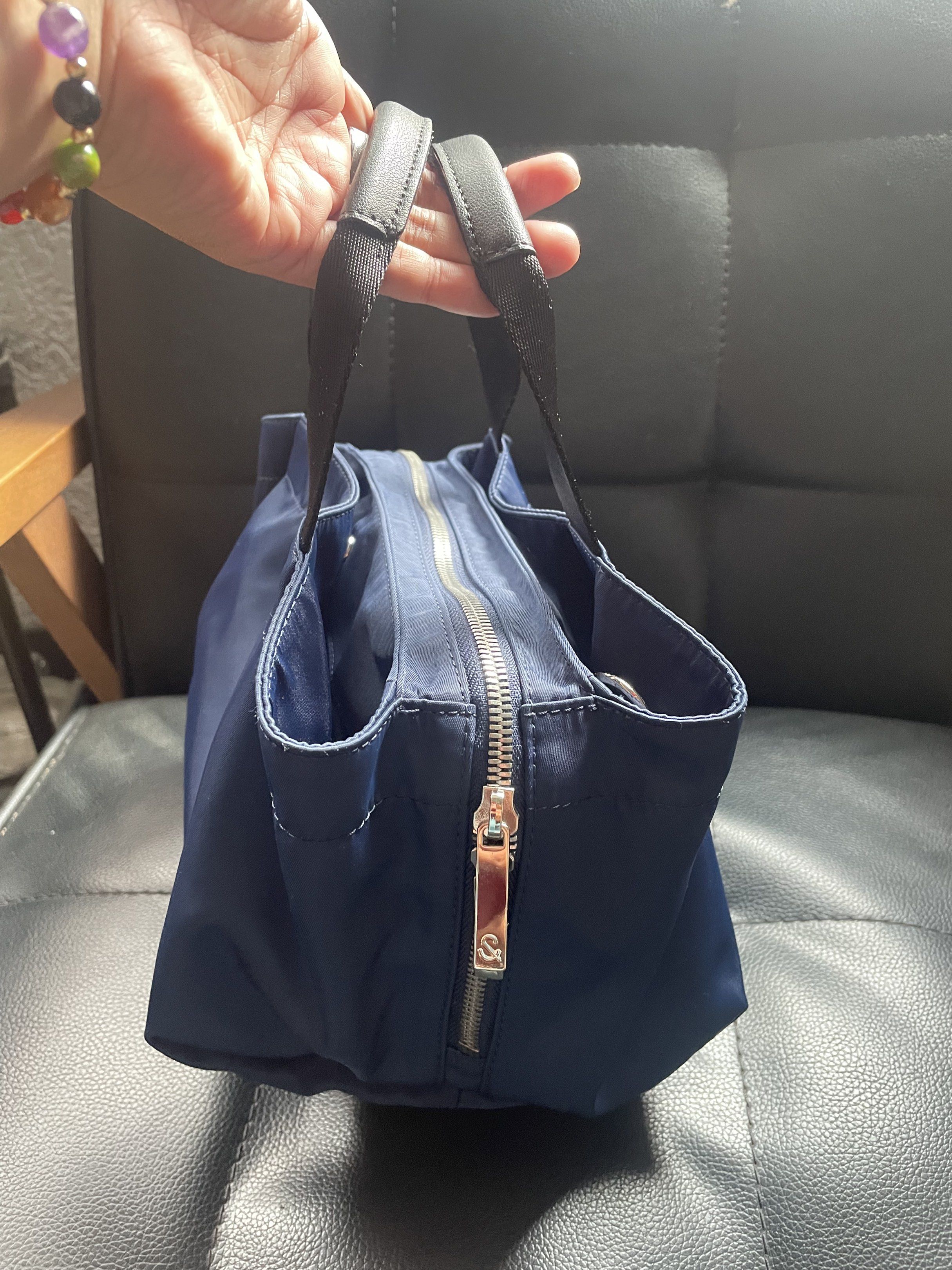 Hershe Navy Blue Handbag with Shoulder Strap (Category: Cross-body Bags) located in Cainta. Submitted by robbynt (Listing ID 1417826523, Image 3). Description: 👗👟👜 Part of my closet clean-out! Letting go of some of my faves — all preloved and in great shape. From my closet to yours. 😊 ✅ Color - navy blue ✅ Size - small ✅ Bag type - 2 way: handbag & sling ✅ Bag closure - zipper & magnetic lock ✅ Hardware - silver ✅ Adjustable removable strap ✅