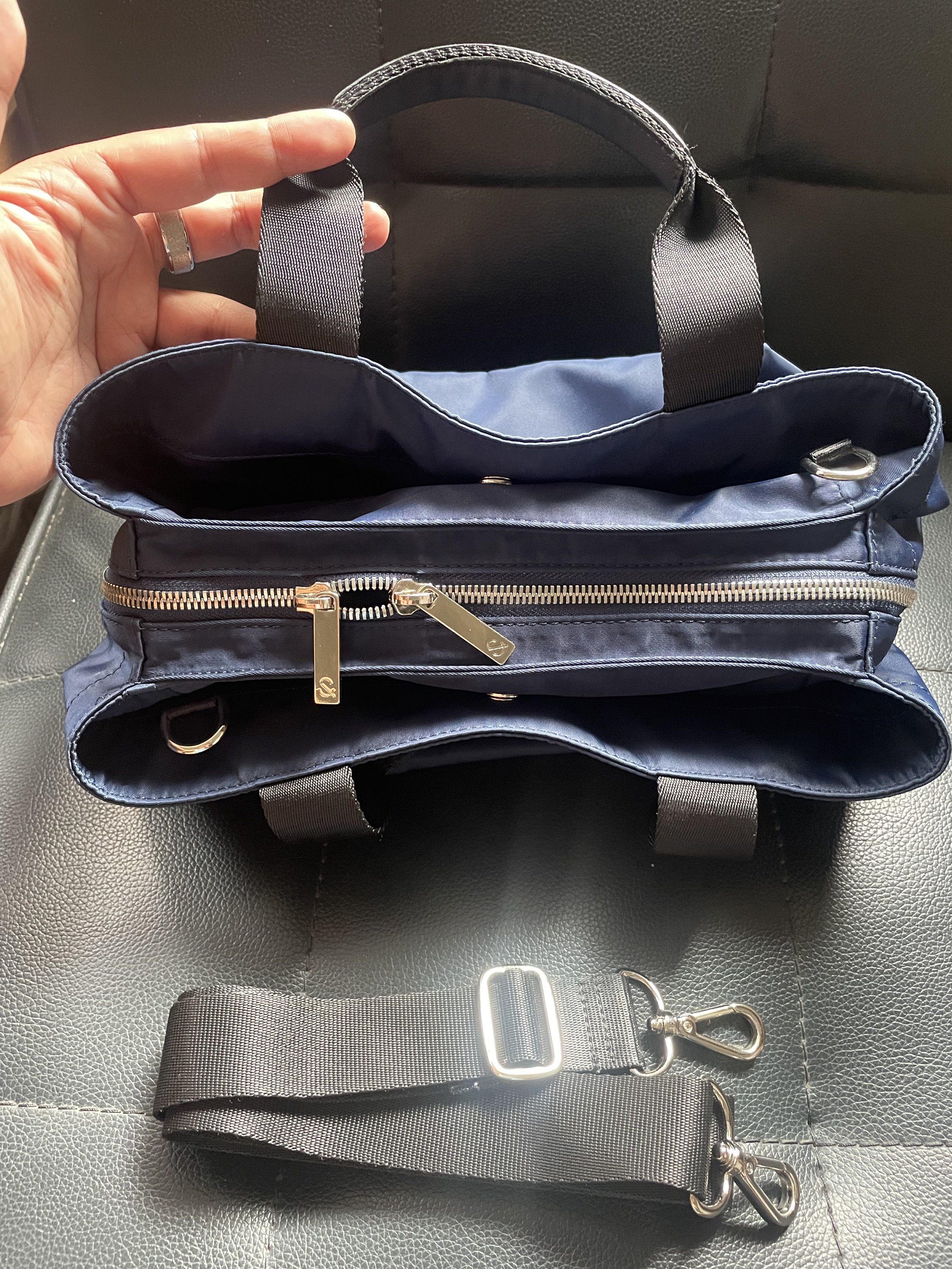 Hershe Navy Blue Handbag with Shoulder Strap (Category: Cross-body Bags) located in Cainta. Submitted by robbynt (Listing ID 1417826523, Image 2). Description: 👗👟👜 Part of my closet clean-out! Letting go of some of my faves — all preloved and in great shape. From my closet to yours. 😊 ✅ Color - navy blue ✅ Size - small ✅ Bag type - 2 way: handbag & sling ✅ Bag closure - zipper & magnetic lock ✅ Hardware - silver ✅ Adjustable removable strap ✅