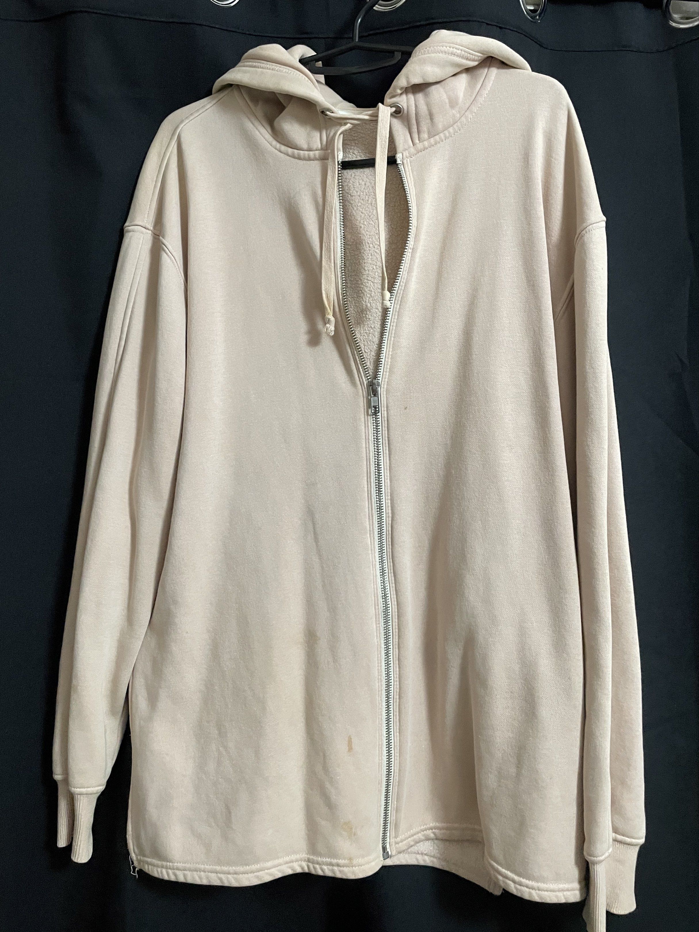 H&M Zip-Up Hoodie - Size S (Category: Hoodies) located in Manila. Submitted by kyletrvs (Listing ID 1417888279, Image 1). Description: H&M Jacket zip-up hoodie is a size S. It features a full zip closure, a hood, and long sleeves. The hoodie has a light beige color. There are some visible stains on the front. In need for wash.