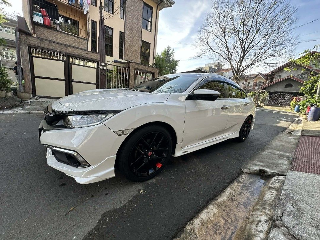 Honda Civic 1.8 VTI E CVT MMC MODULO Auto (Category: Used Cars) located in Manila. Submitted by dcmobility (Listing ID 1417885951, Image 3). Description: 2016 Honda Civic 1.8 E CVT Modulo Edition A1 Condition | Casa-Maintained | Cash Only 📍 Eastwood, QC Details: 1st owner, 116,669 km Original Modulo body kit & 18" mags Brand new tires Complete PMS records Always garaged No accident/flood/repaint Inclusions: Comprehensive insurance (transferable)