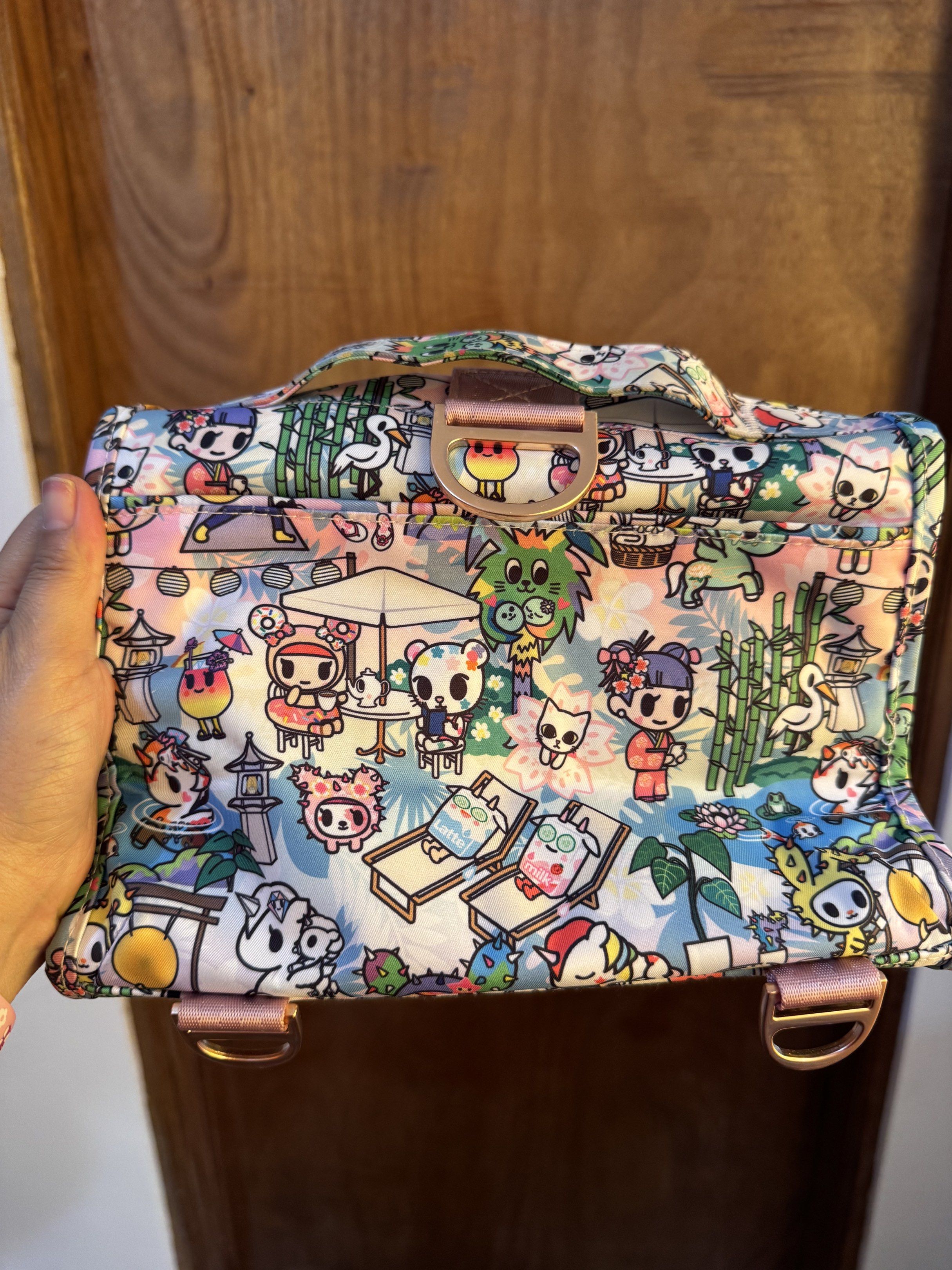 JuJuBe Toki Retreat Bestie (Category: Diaper Bags & Wetbags) located in Dagupan City. Submitted by francesco11 (Listing ID 1417936830, Image 3). Description: - JuJuBe Be Set with a fun Tokidoki print. - Multiple zippered compartments for organization. - Convenient top handle. - Stylish light pink trim and gold-colored hardware. - Includes a detachable charm. - Made from durable, patterned fabric..
