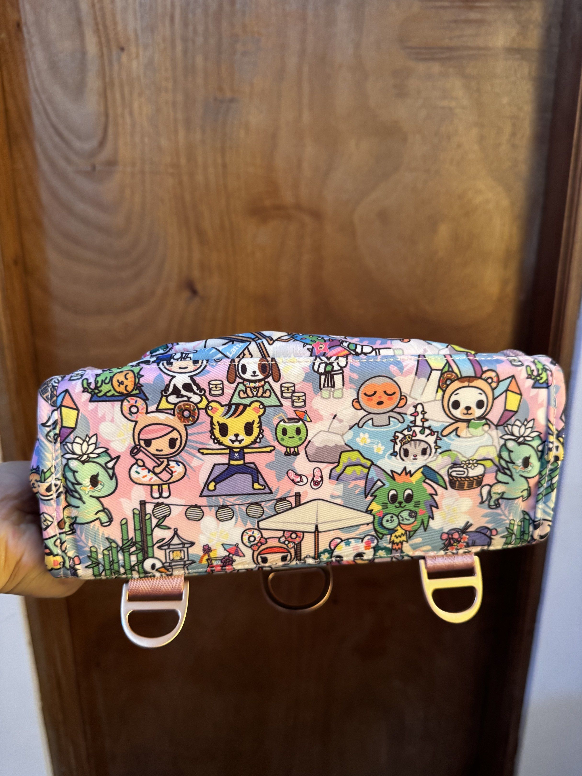 JuJuBe Toki Retreat Bestie (Category: Diaper Bags & Wetbags) located in Dagupan City. Submitted by francesco11 (Listing ID 1417936830, Image 2). Description: - JuJuBe Be Set with a fun Tokidoki print. - Multiple zippered compartments for organization. - Convenient top handle. - Stylish light pink trim and gold-colored hardware. - Includes a detachable charm. - Made from durable, patterned fabric..