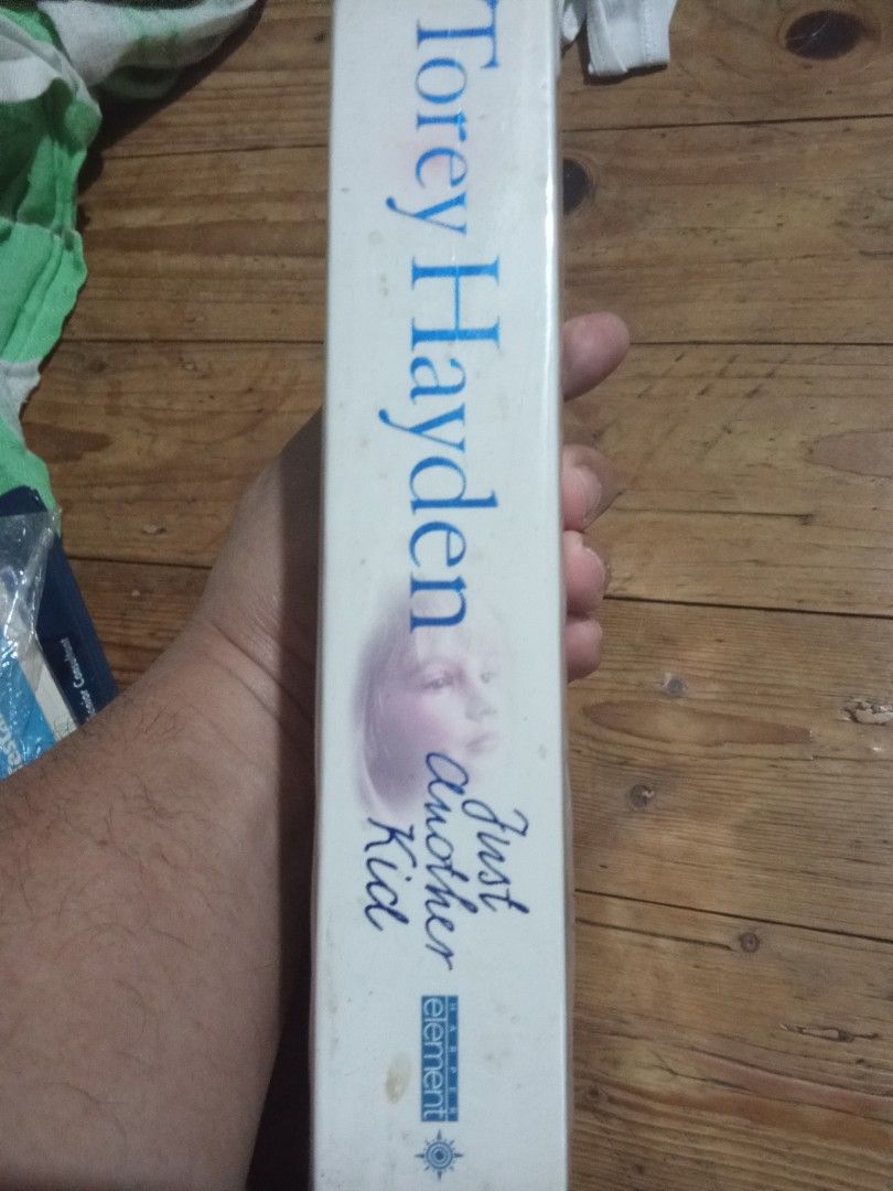 Just another kid by torey hayden (Category: Children's Books) located in Pasig City. Submitted by teebeedeee (Listing ID 1418007622, Image 2). Description: - "Just Another Kid" by Torey Hayden. - Fiction genre. - Features a compelling story about a teacher and her students. - Ideal for readers who enjoy emotional and inspiring stories. preowned authentic paperback copy complete pages plastic covered.pages have yellowed due to storage and no visib