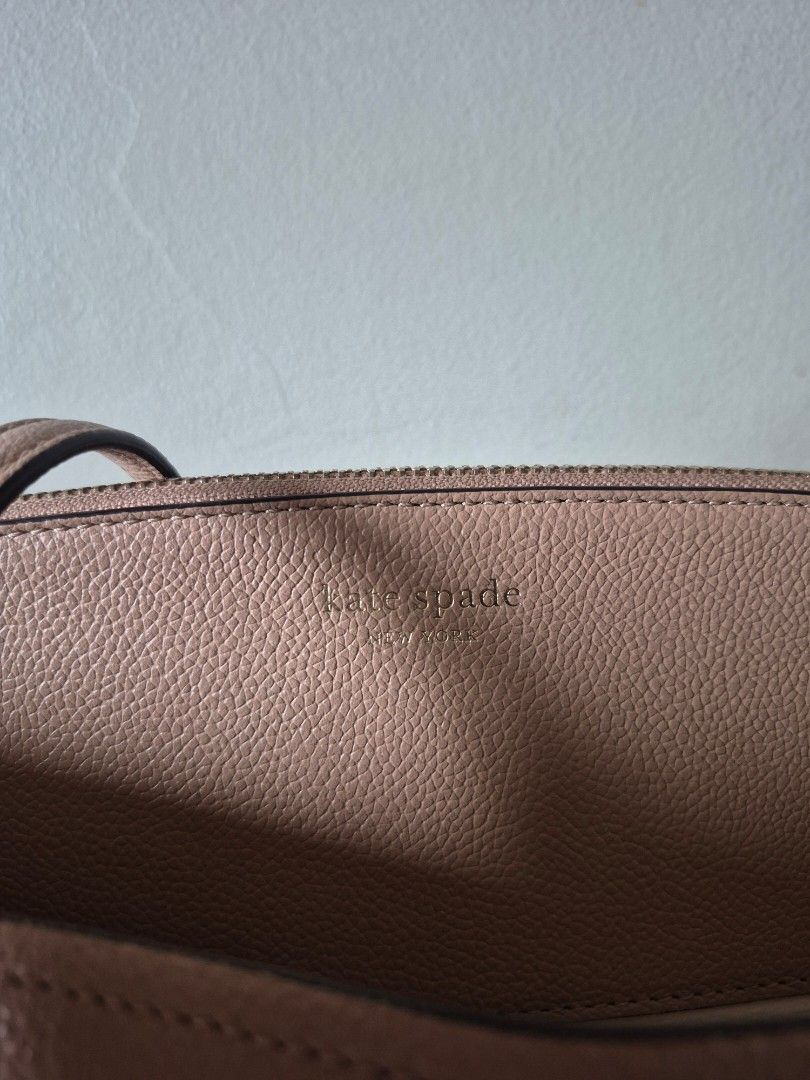 Kate Spade Margaux Large Tote Bag (Category: Tote Bags) located in Mandaluyong City. Submitted by mandybsa (Listing ID 1417825584, Image 2). Description: - Kate Spade tote bag - Neutral color - Top handles - Spacious interior with multiple compartments including cushioned zipped pocket for laptop and small interior pocket for cards - Textured leather - Interior lining in a lighter shade - Small tag detail - Price negotiable - Condition: Interior 