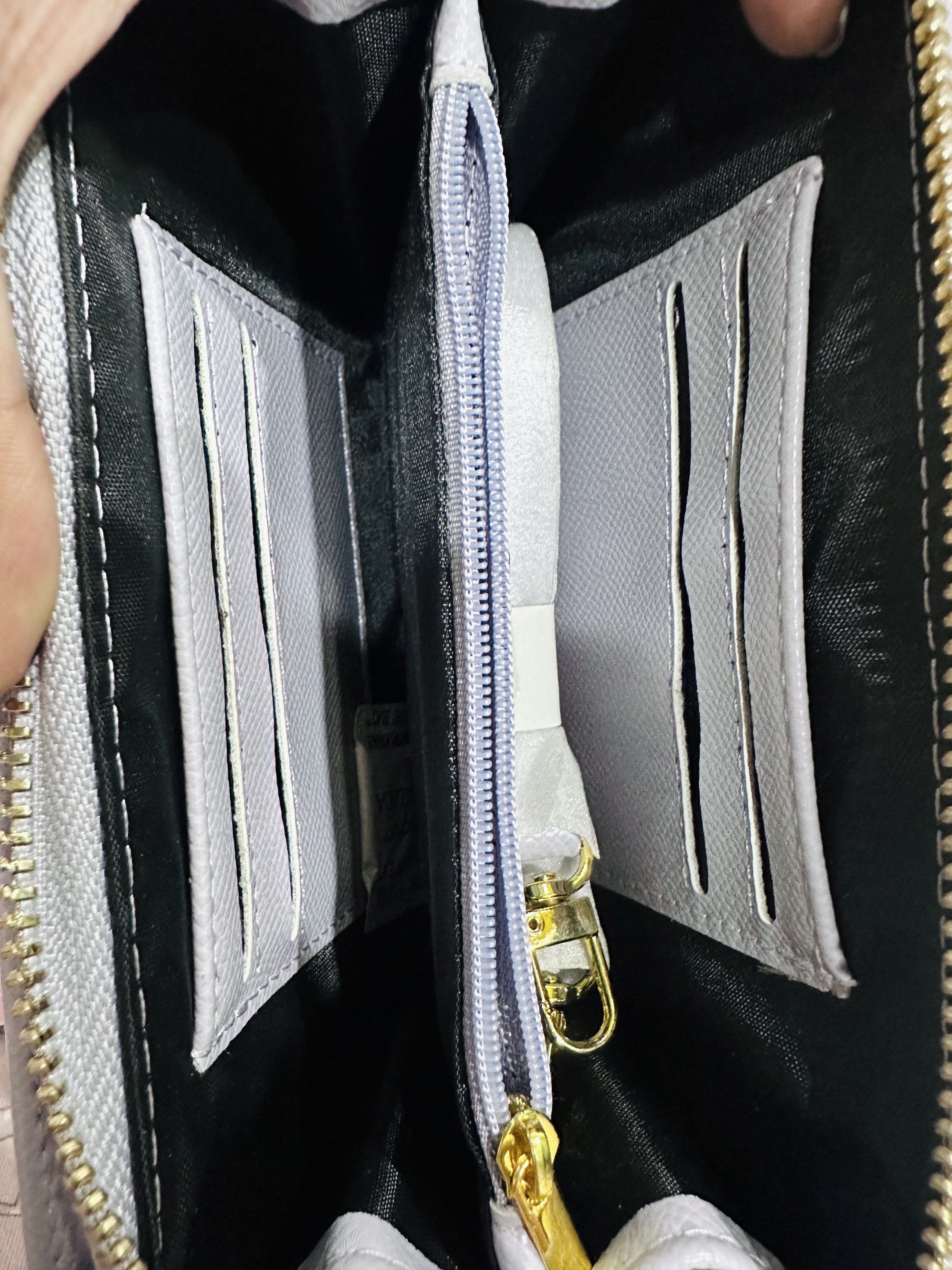 HOLB Lilac Cellphone/Wallet Bag with Strap (Category: Cross-body Bags) located in Manila. Submitted by amethyste_ph (Listing ID 1417853922, Image 2). Description: - Lilac cellphone bag - Flap closure with gold-colored logo - Detachable strap - Zippered compartment - Card slots and additional storage inside - Comes with tag and original packaging.