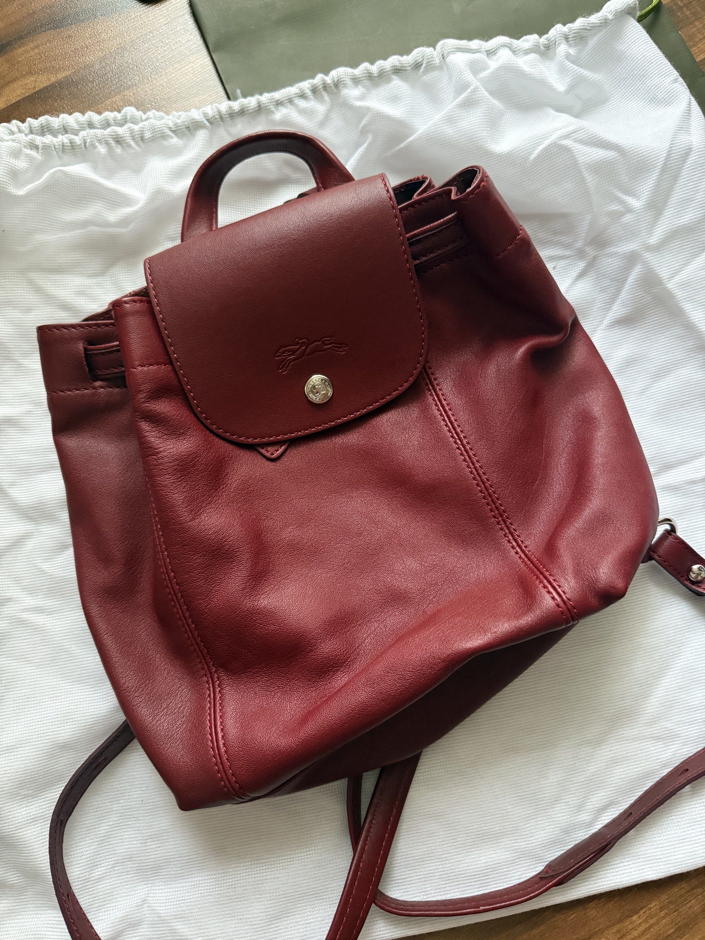 Longchamp Le Pliage leather backpack (Category: Luxury Bags & Wallets) located in Mandaluyong City. Submitted by triciaaaas (Listing ID 1417831444, Image 3). Description: Model / Style: Le Pliage Leather Backpack Color: Burgundy Material: Premium soft leather with durable nylon accents (signature Longchamp quality) Features: • Elegant & timeless design — classic Longchamp look • High-quality leather construction — soft yet durable • Spacious inte