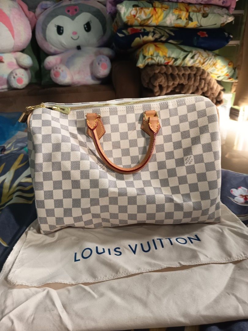 Louis Vuitton Damier Azur Speedy 30 (Category: Luxury Bags & Wallets) located in Valenzuela. Submitted by samracab13 (Listing ID 1417901512, Image 2). Description: - Authentic Louis Vuitton Speedy 30 - Damier Azur pattern - Vachetta leather handles and trim - Includes original dust bag - Clean interior - Top zipper closure - Spacious interior - Timeless and stylish handbag.