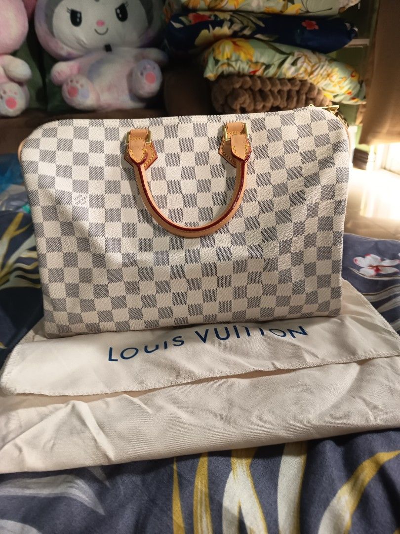 Louis Vuitton Damier Azur Speedy 30 (Category: Luxury Bags & Wallets) located in Valenzuela. Submitted by samracab13 (Listing ID 1417901512, Image 1). Description: - Authentic Louis Vuitton Speedy 30 - Damier Azur pattern - Vachetta leather handles and trim - Includes original dust bag - Clean interior - Top zipper closure - Spacious interior - Timeless and stylish handbag.