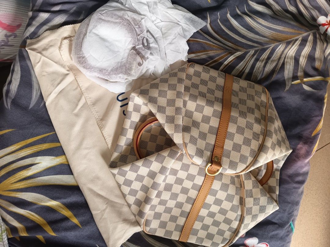 Louis Vuitton Damier Azur Speedy 30 (Category: Luxury Bags & Wallets) located in Valenzuela. Submitted by samracab13 (Listing ID 1417901512, Image 3). Description: - Authentic Louis Vuitton Speedy 30 - Damier Azur pattern - Vachetta leather handles and trim - Includes original dust bag - Clean interior - Top zipper closure - Spacious interior - Timeless and stylish handbag.