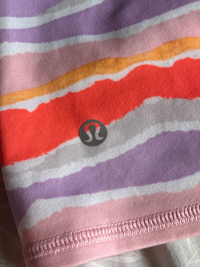 Lululemon Dancing Warrior Tank (Category: Activewear) located in Quezon City. Submitted by martits (Listing ID 1417935228, Image 2). Description: Authentic Lululemon · Dot size: 4 Colorful striped pattern - Color palette: Purple, orange, pink, and white - Built-in bra with unique criss-cross back straps (no pads) - Scoop neck - Fitted silhouette - Made from lightweight athletic material - Compressive and slimming! - Can be worn as tankini top.