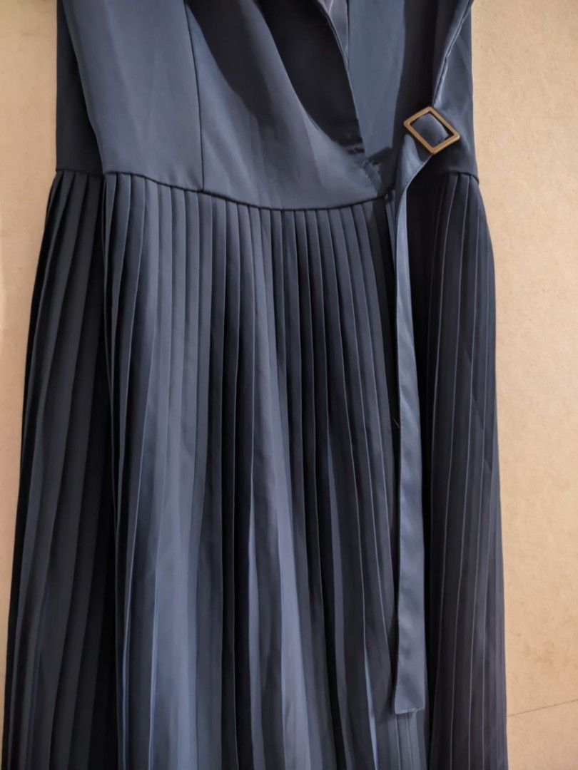 Navy Blue Pleated Dress (Category: Dresses) located in Manila. Submitted by elixiriaz (Listing ID 1417856169, Image 2). Description: - Navy blue dress - Pleated skirt - Collared neckline - Belt with buckle - Sleeveless - Tie-inside for extra security - Perfect for formal events.
